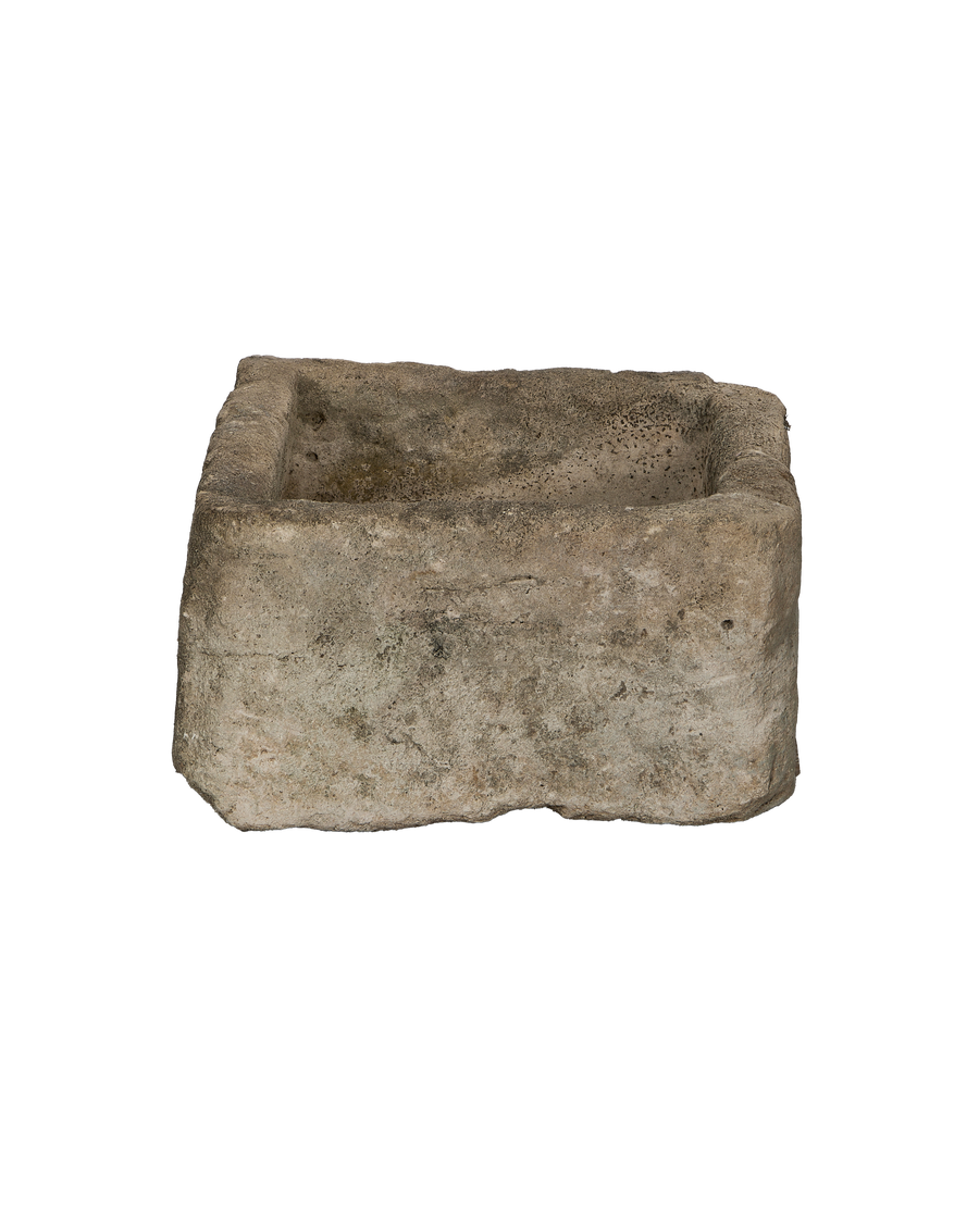 Vintage rectangular limestone trough from Indonesia, showcasing weathered surface textures from a low angle.
