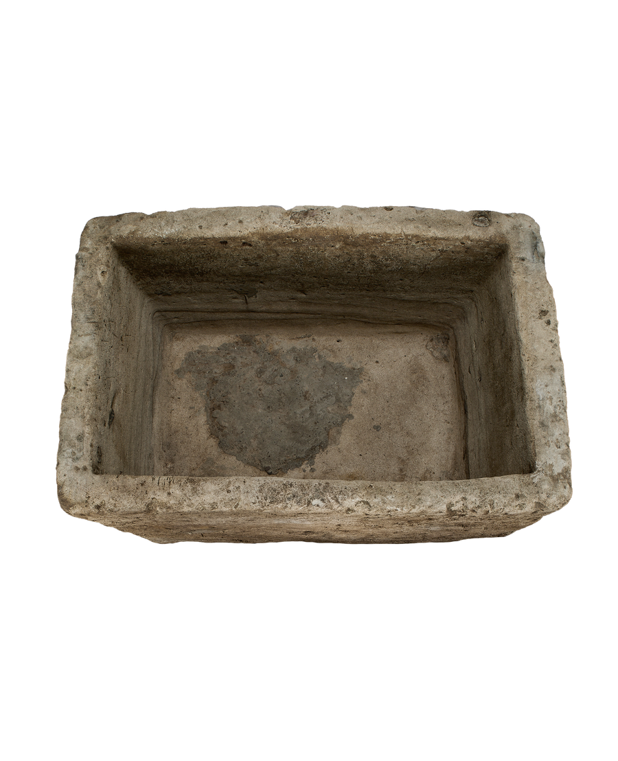 Vintage rectangular limestone trough, showing the rustic, textured interior basin and rough-hewn edges.