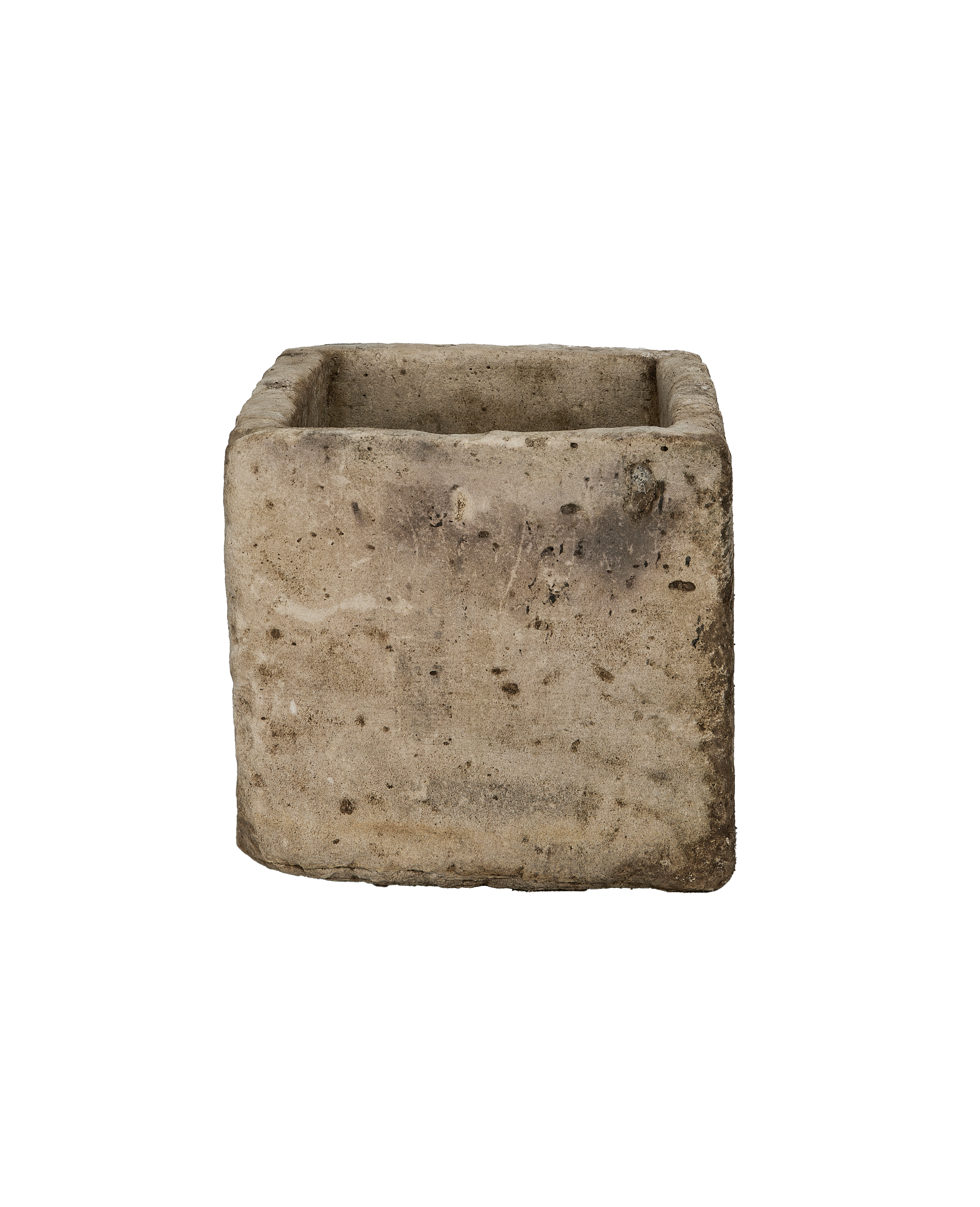 Vintage Indonesian limestone trough viewed from the side, showing rough texture and patina.