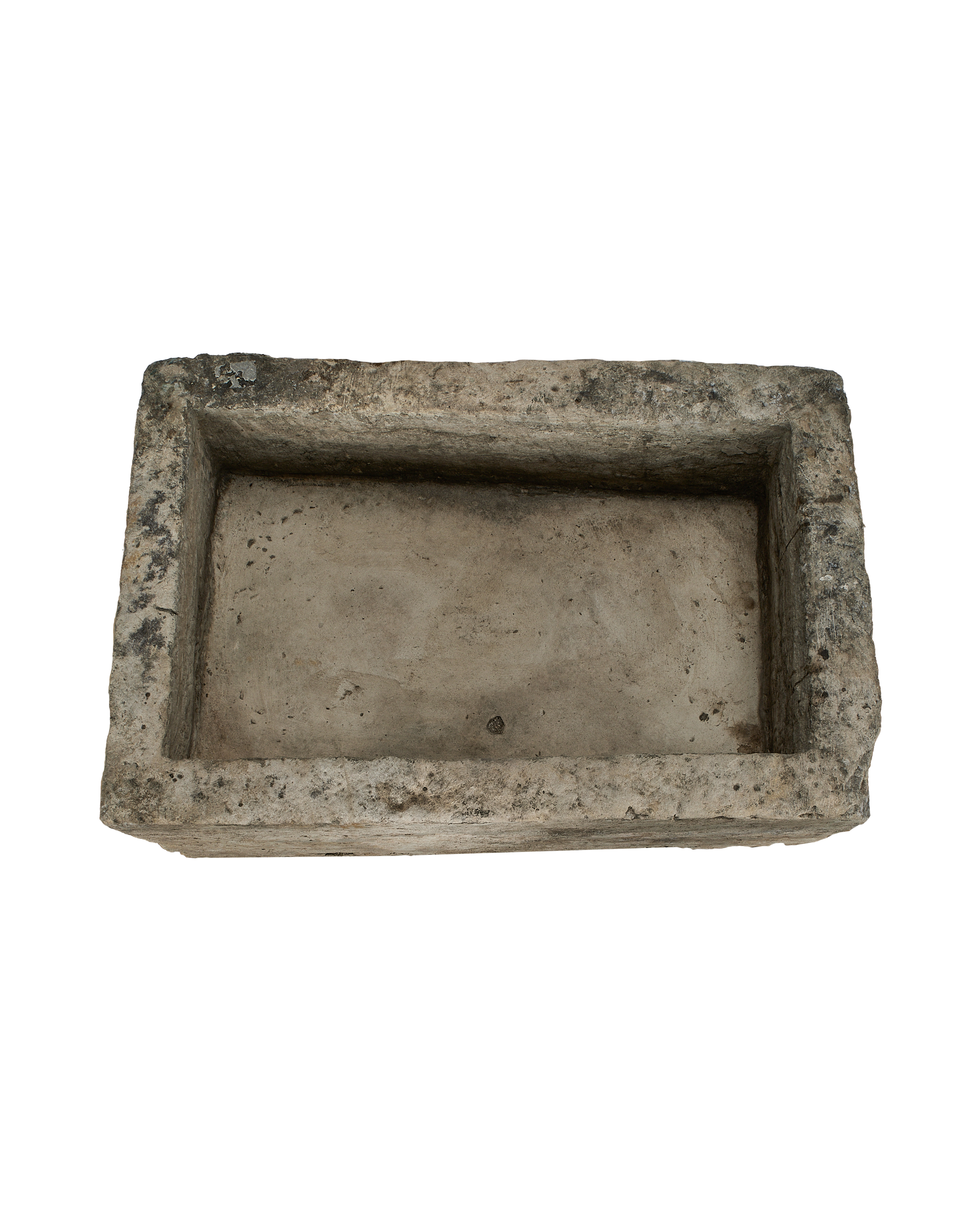 Vintage Indonesian limestone trough (OAK) close-up, showing rough texture, light aging.
