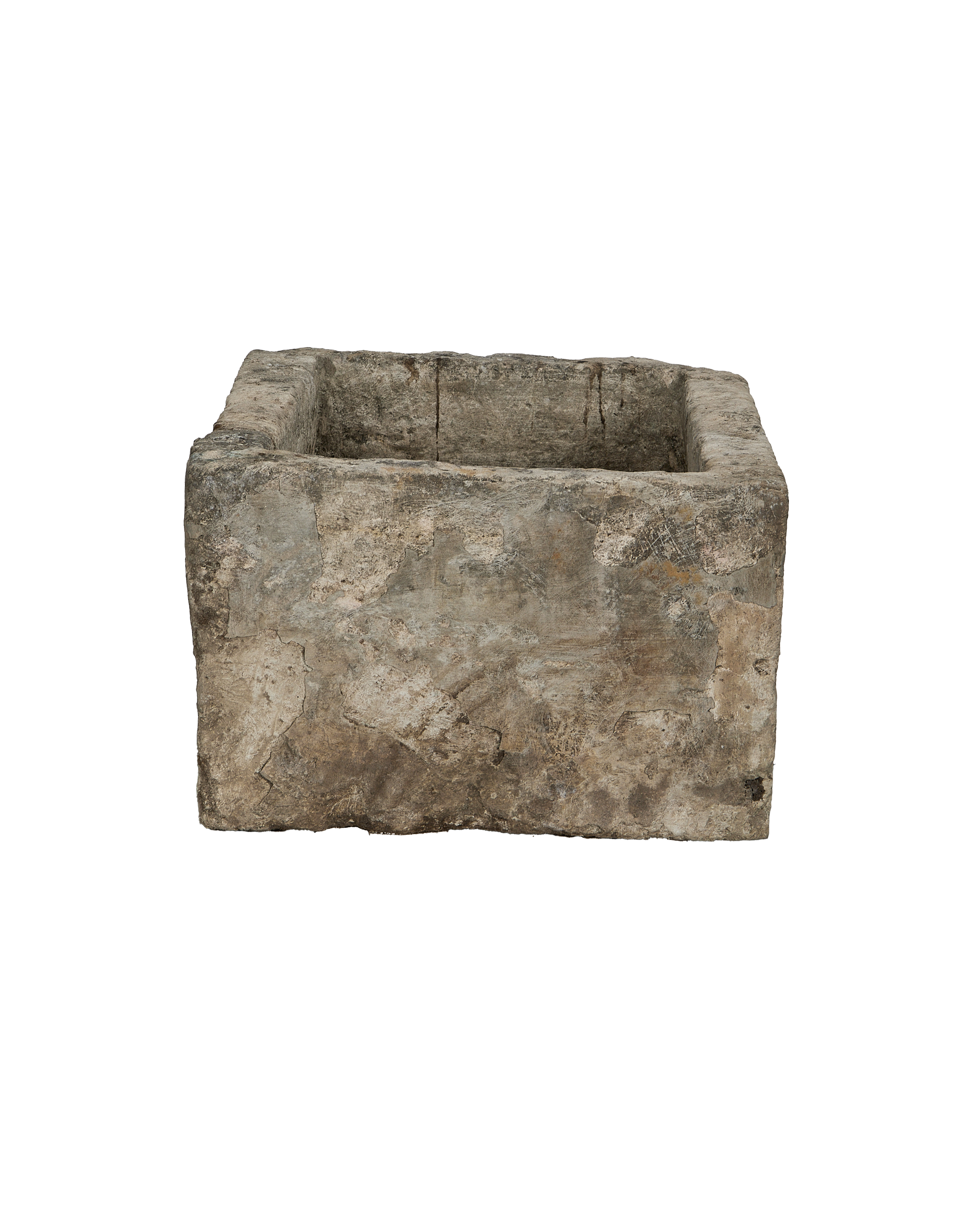 Vintage Indonesian limestone trough viewed slightly from above, highlighting distressed texture.