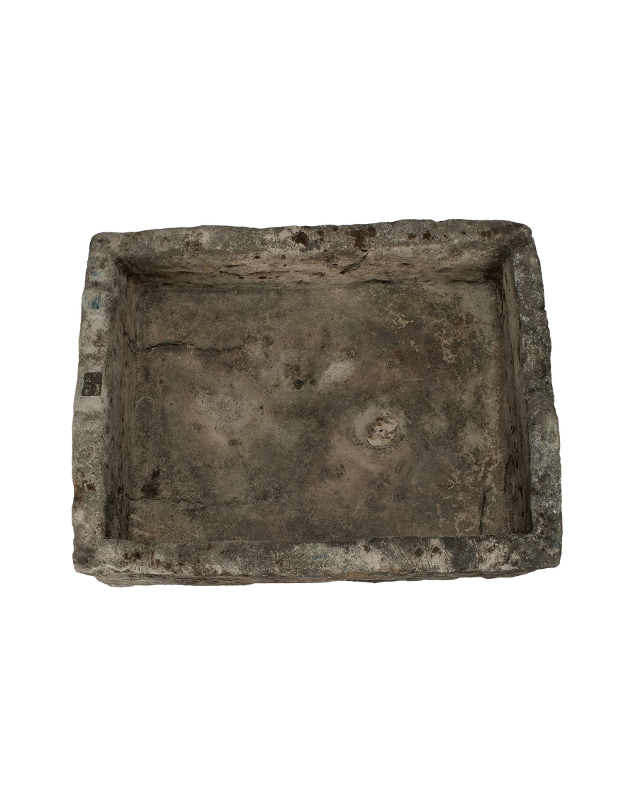 Vintage Indonesian limestone trough, top view down into rectangular form, showing weathered texture.