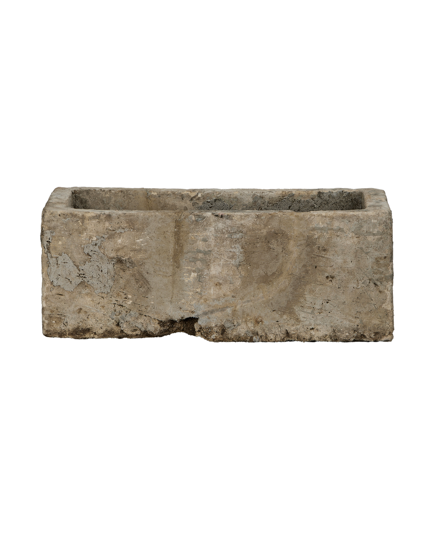 Vintage Indonesian rectangular limestone trough showing full front and textured side.