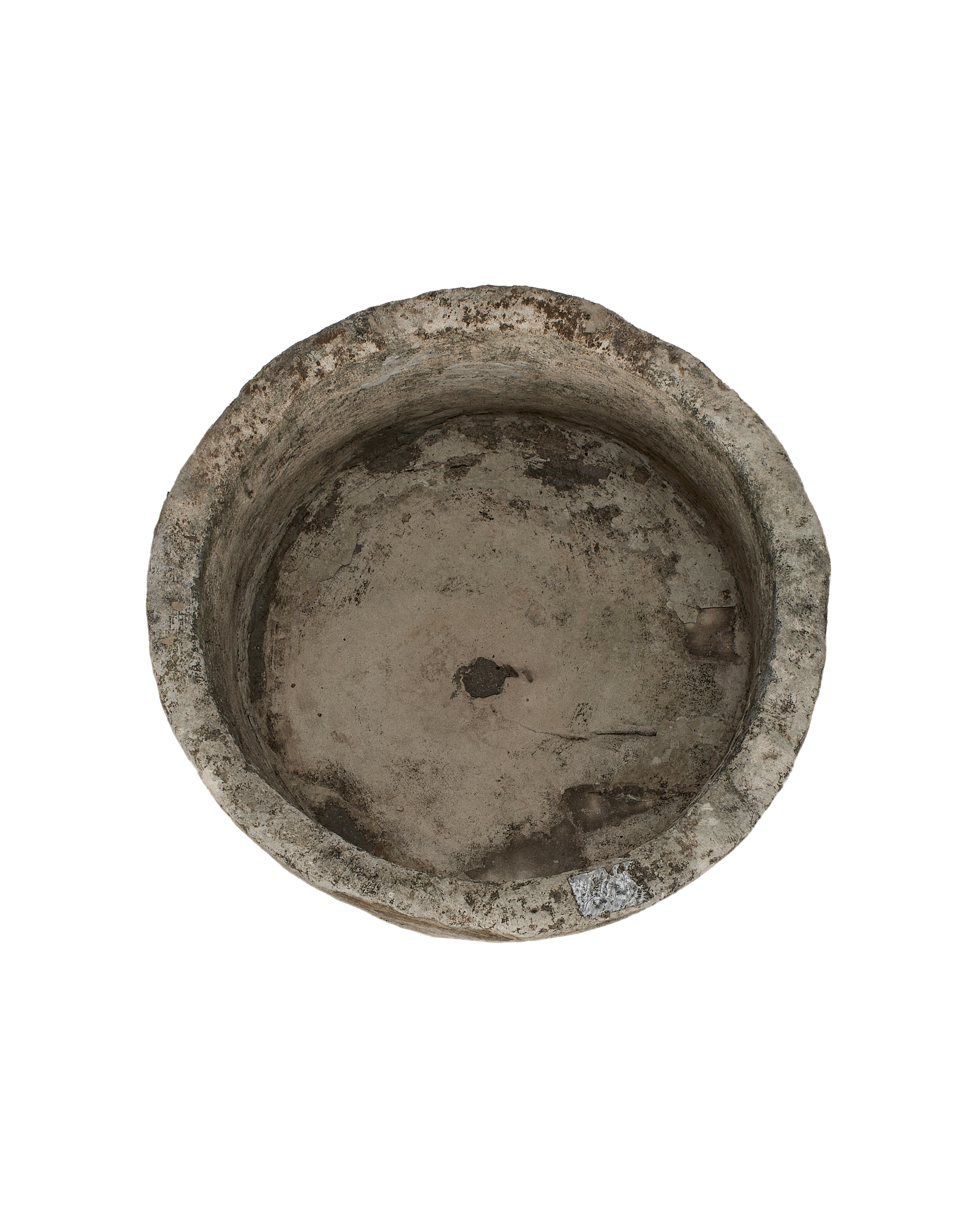Vintage Indonesian round limestone trough, showing weathered interior with natural pit.