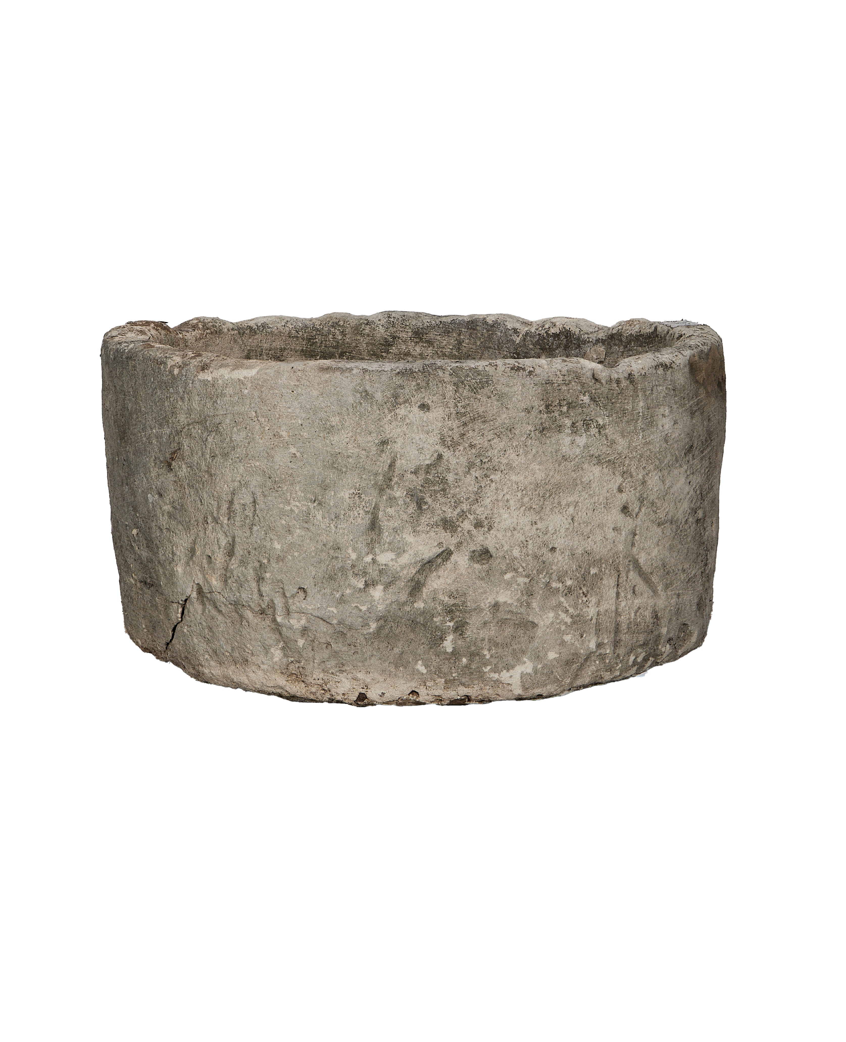 Vintage Indonesian limestone trough, showing rough textured exterior and small bottom crack.