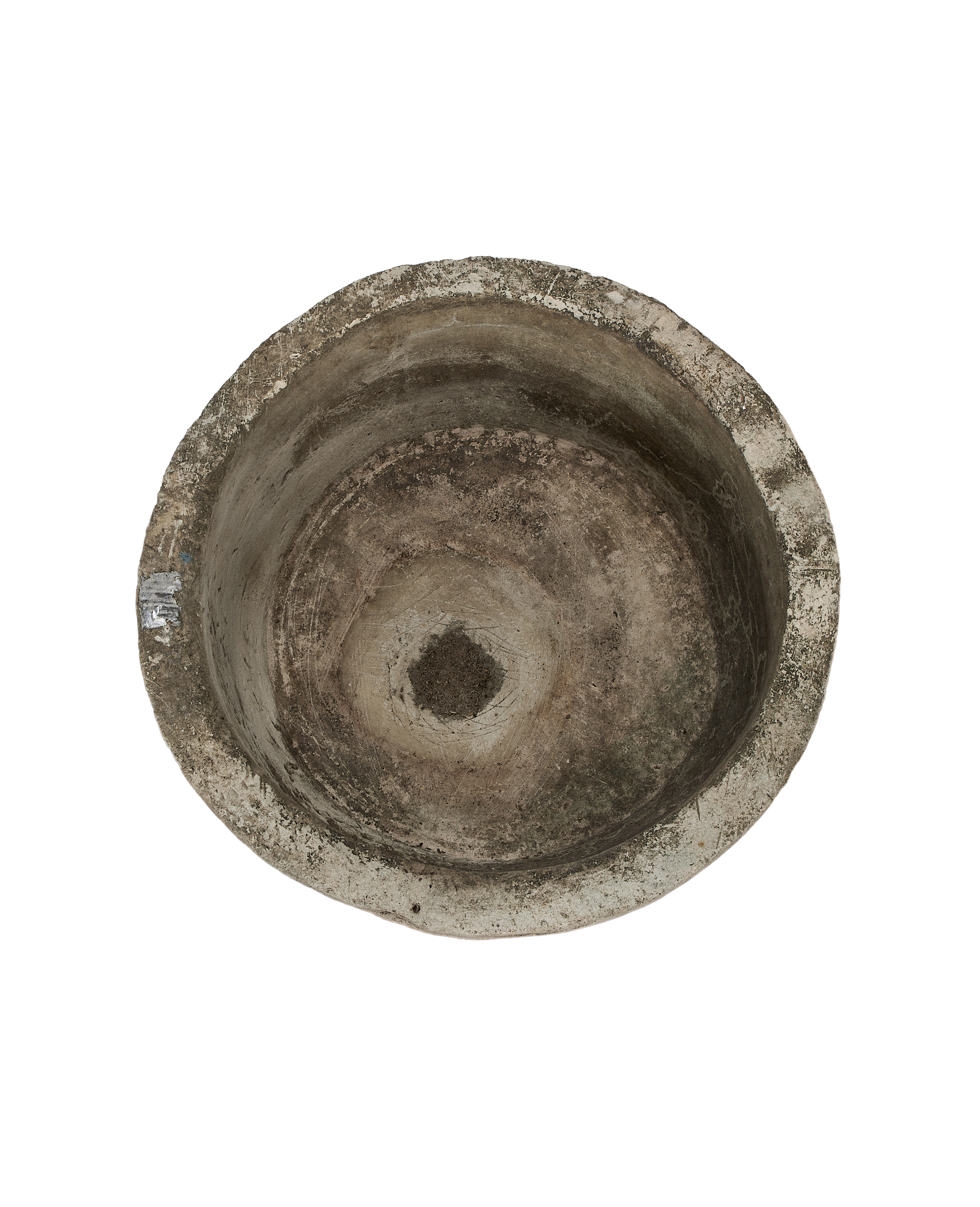 Vintage round Indonesian limestone trough, top-down view showing interior weathering and central drain hole.