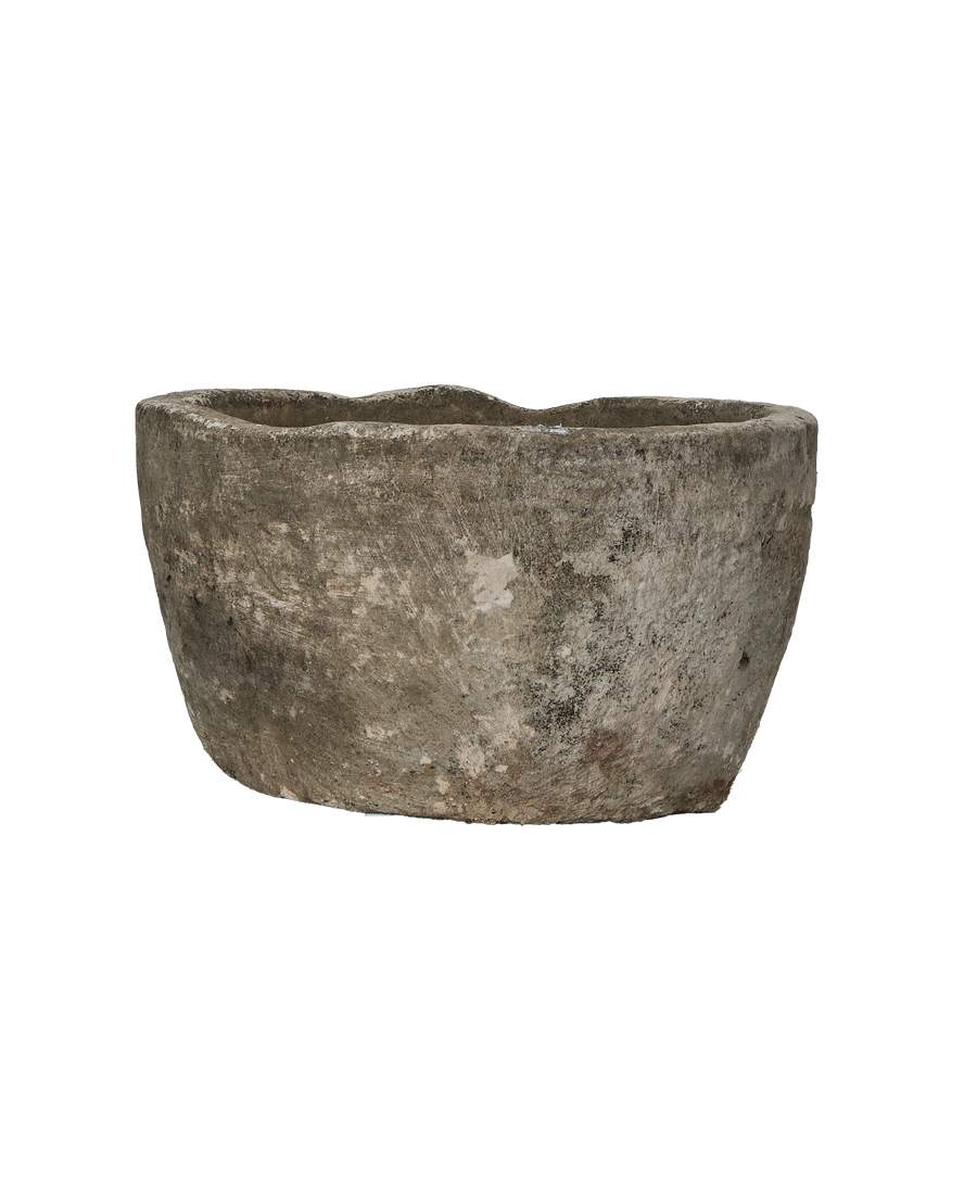 Vintage Indonesian round limestone trough, showing weathered texture and natural gray tone.