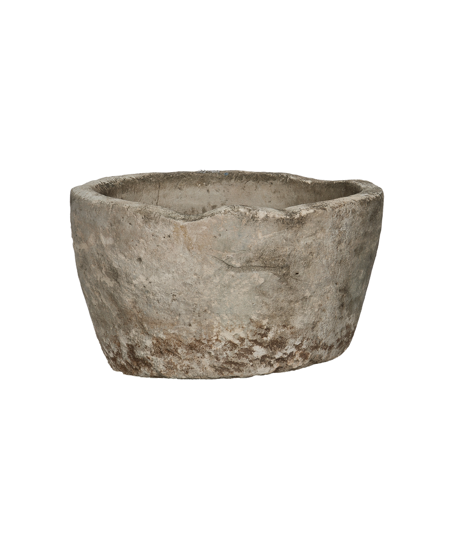 Vintage Indonesian limestone trough closeup, showcasing rough texture and weathered finish.