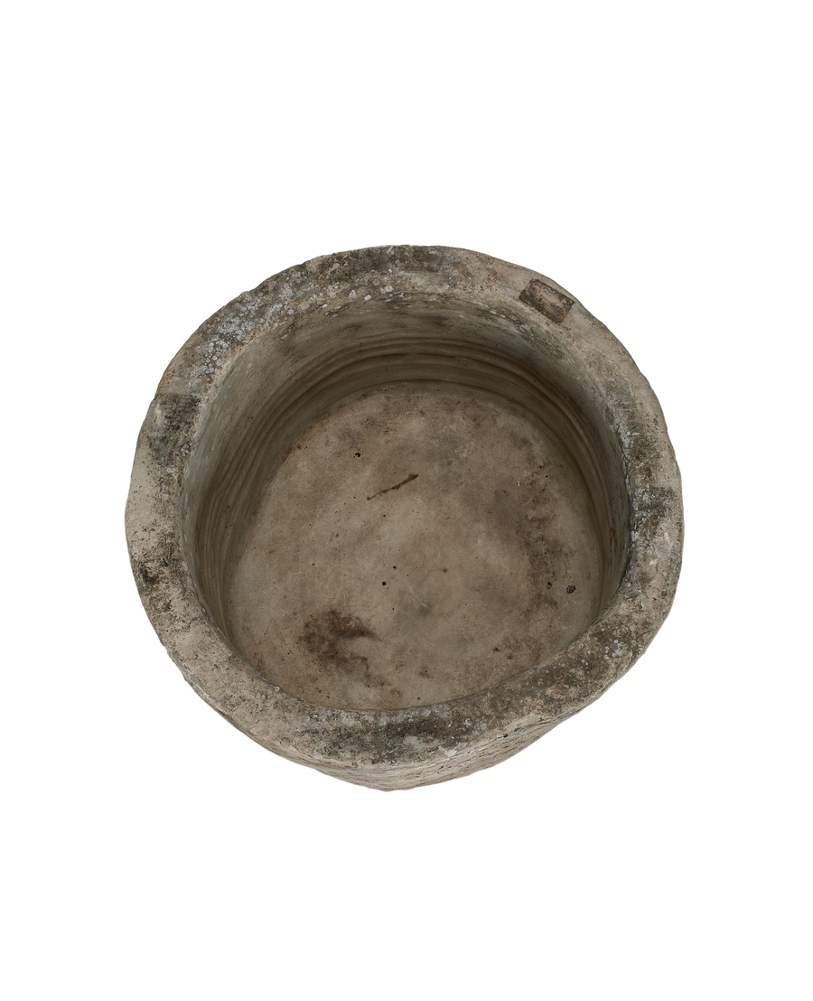 Vintage round limestone trough, Indonesia, top-down view showing interior texture and rim detail.
