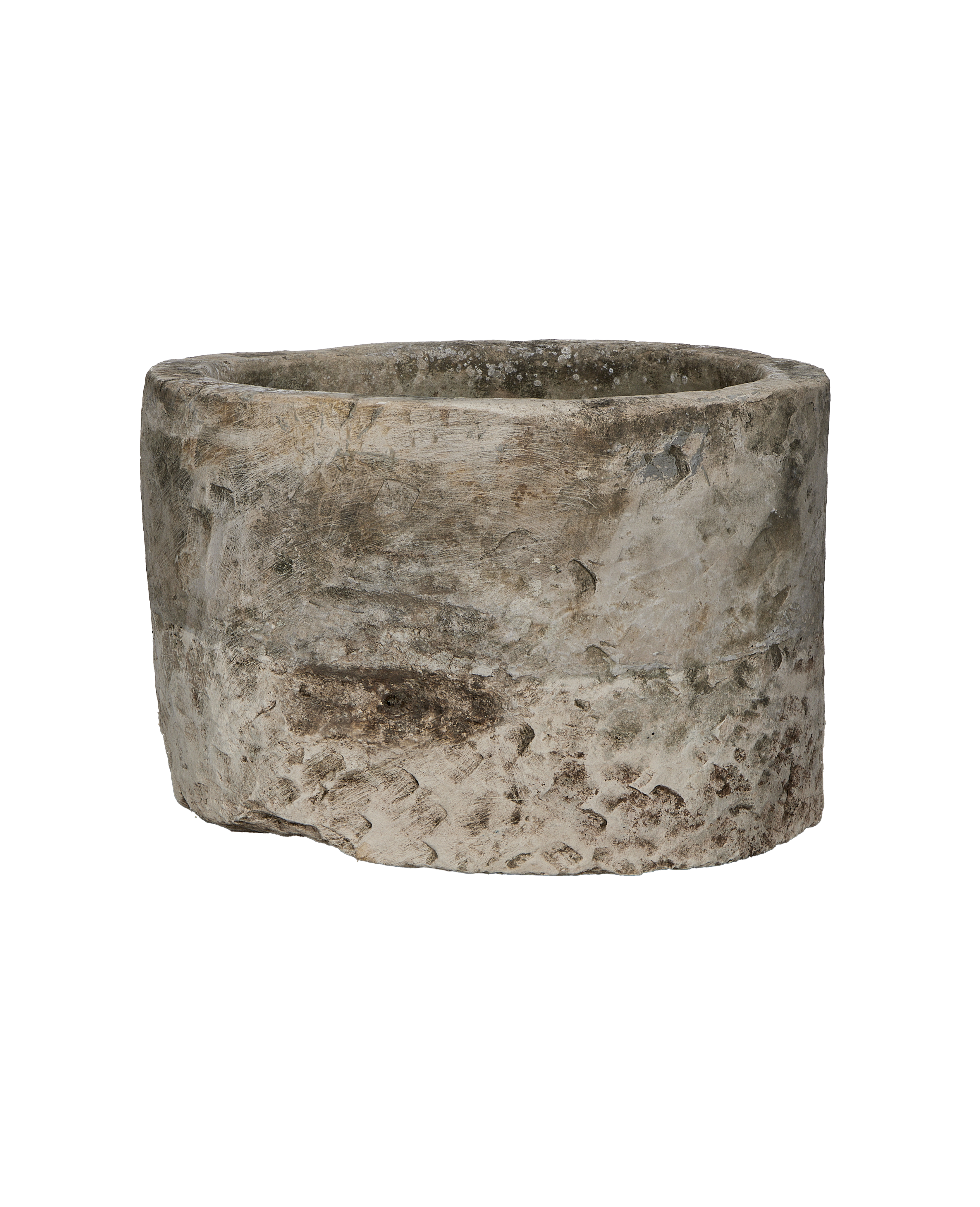 Vintage round Indonesian limestone trough, showing distressed texture and aged patina on the exterior.