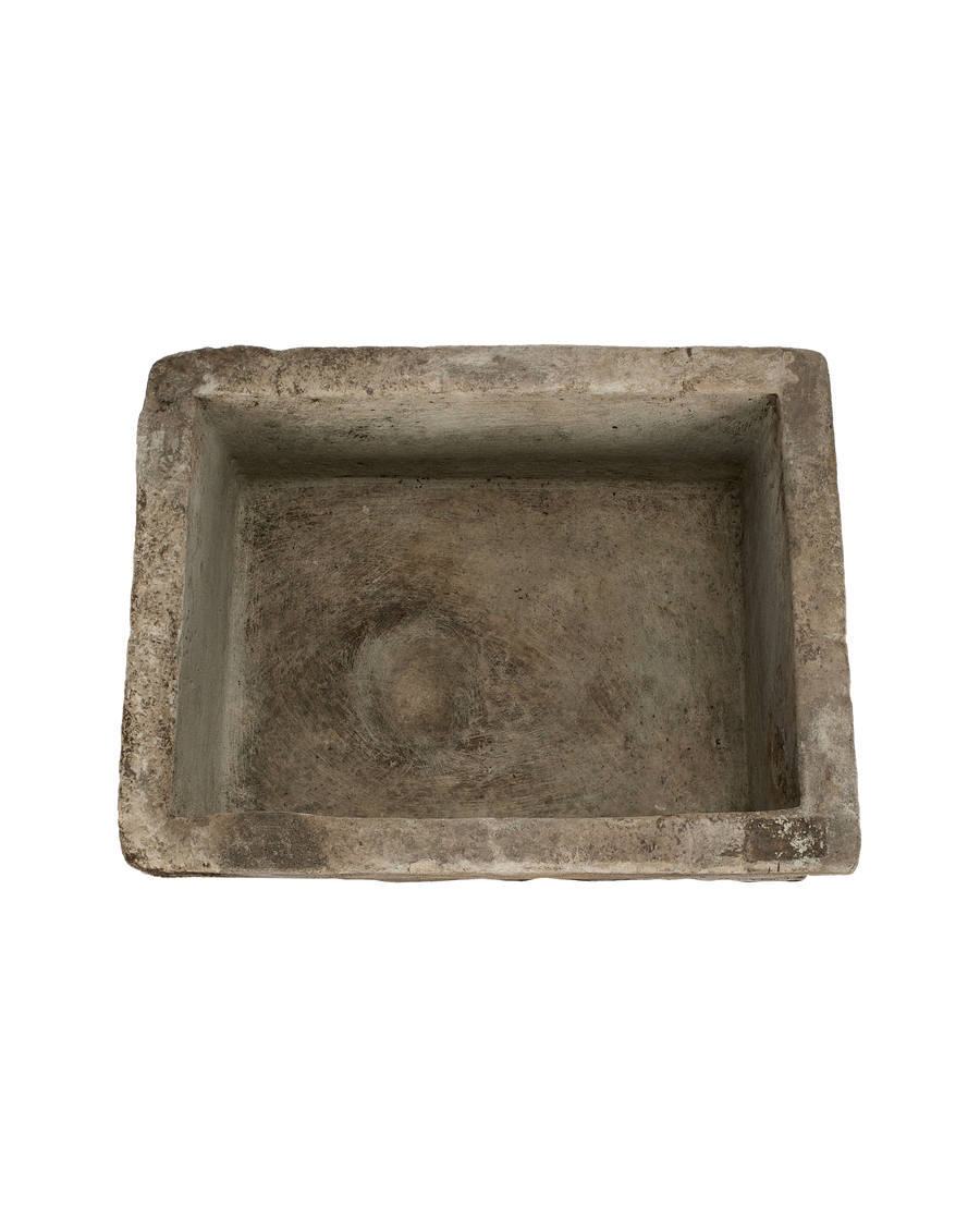 Vintage Indonesian rectangular limestone trough, top-down view showing interior texture and aged patina.