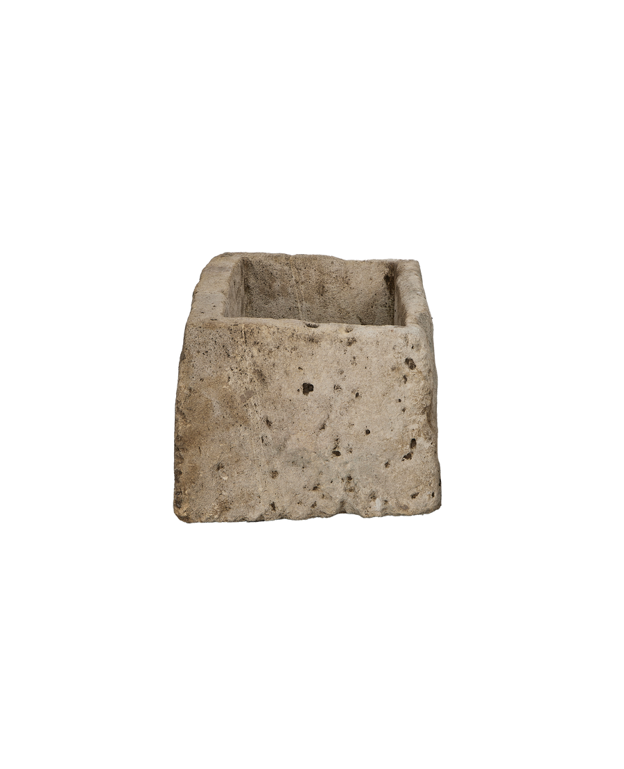 Vintage Indonesian rectangular limestone trough planter with textured, weathered natural stone finish.