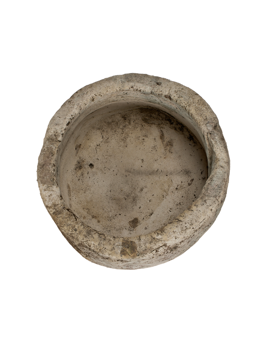 Vintage Indonesian limestone trough, showing weathered texture and surface details from an angled top view.