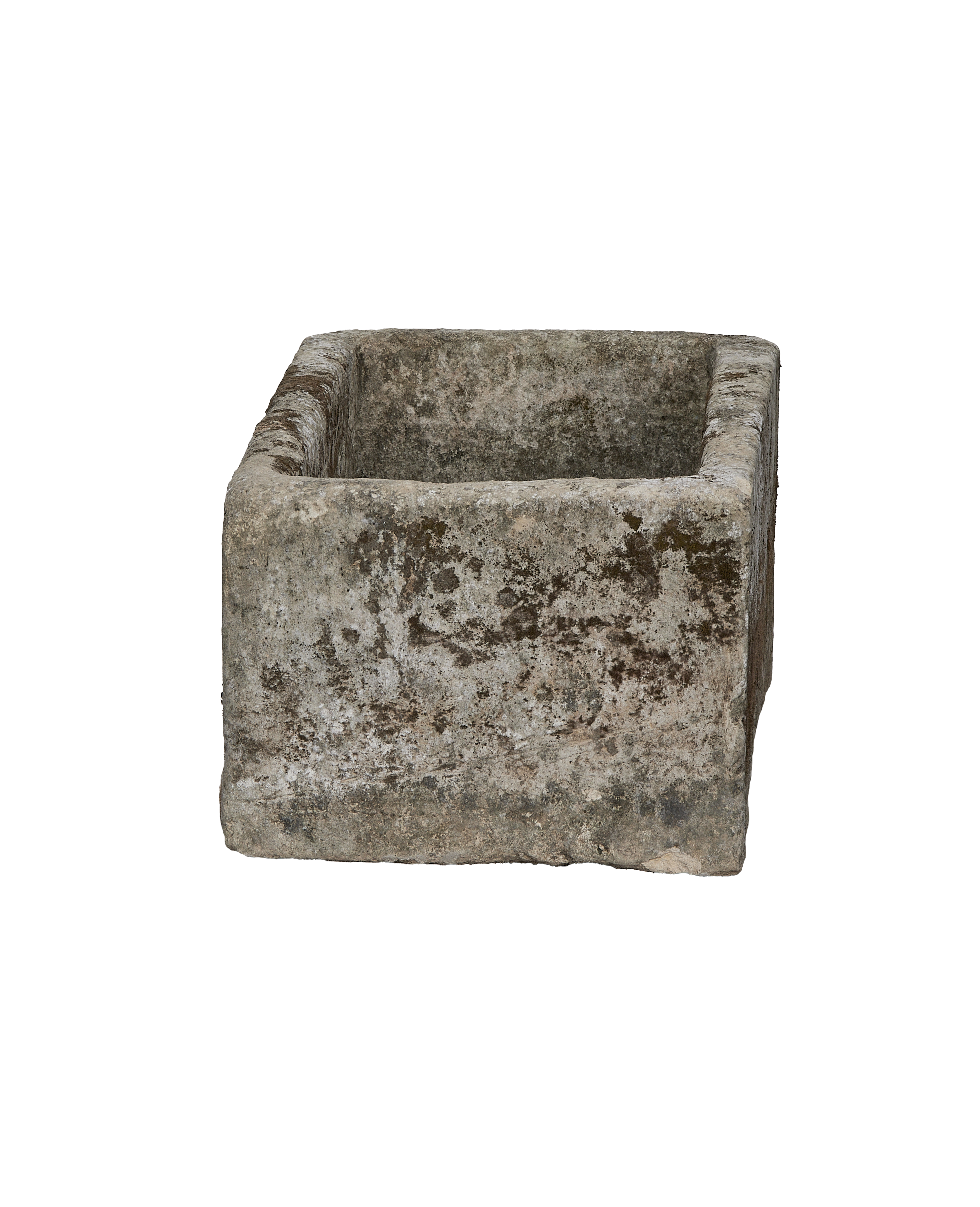 Vintage Indonesian limestone trough viewed diagonally, showcasing weathered texture and moss.