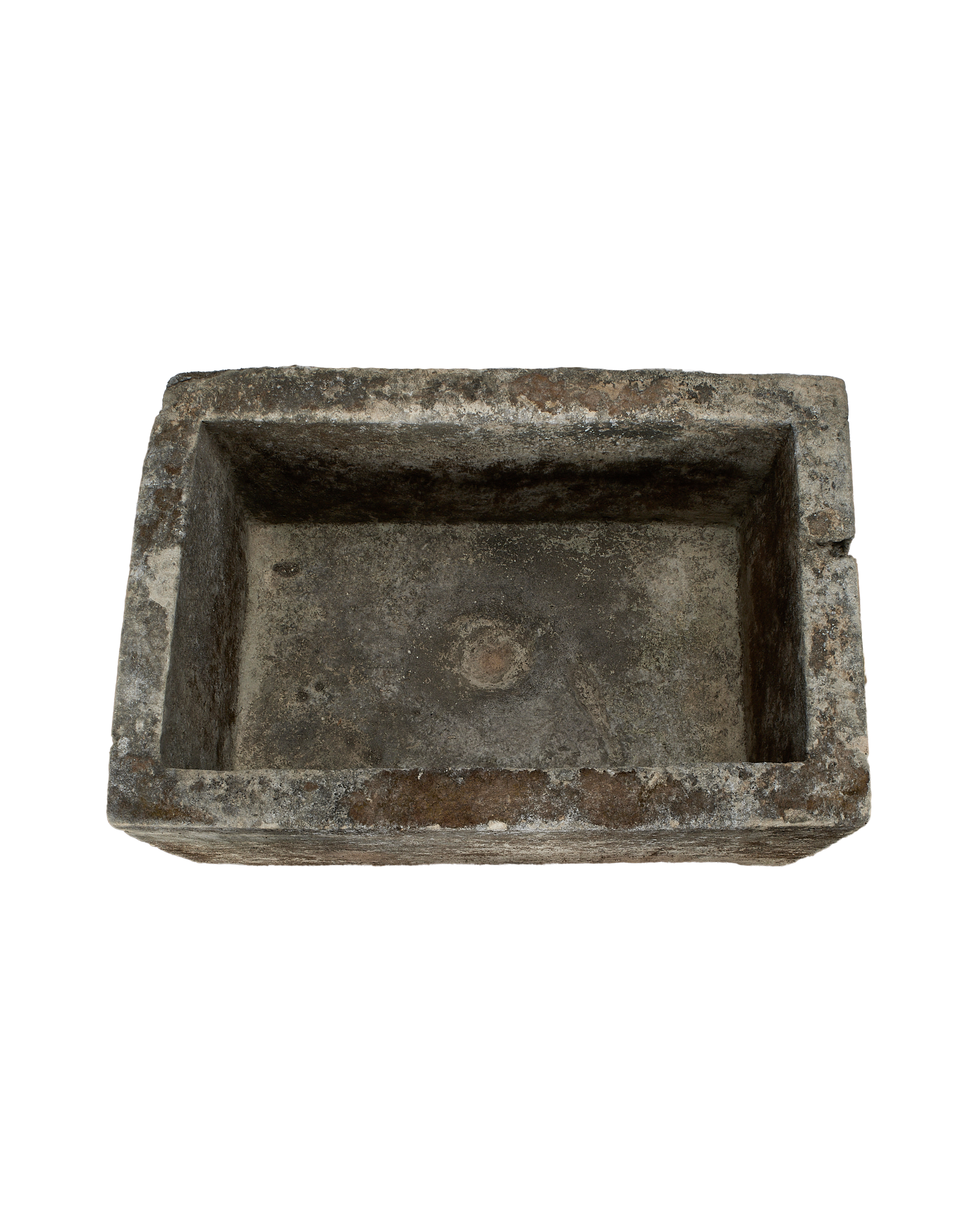 Overhead view vintage Indonesian limestone trough interior, showing weathered texture.