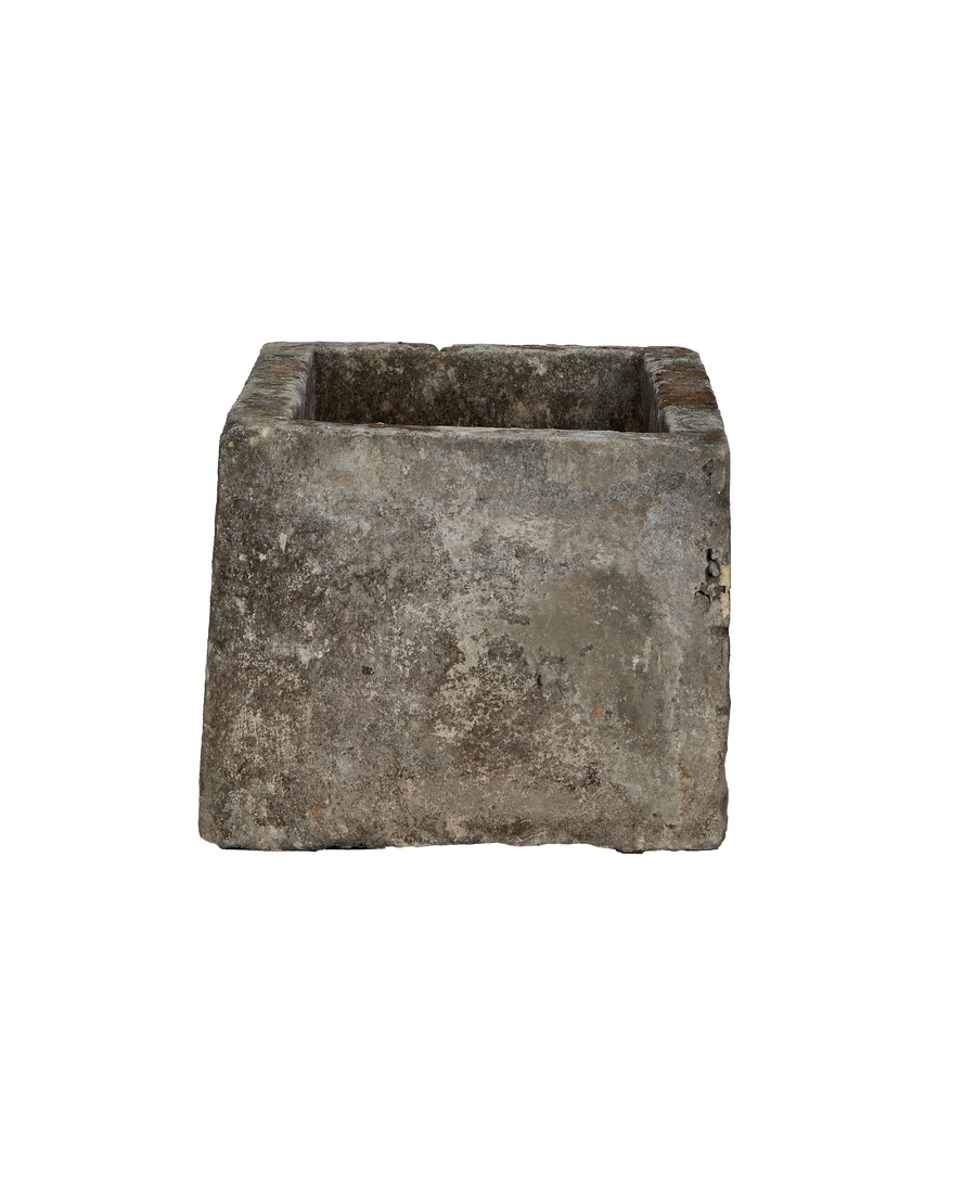 Vintage rectangular Indonesian limestone trough with weathered texture from a unique, low-angle view.