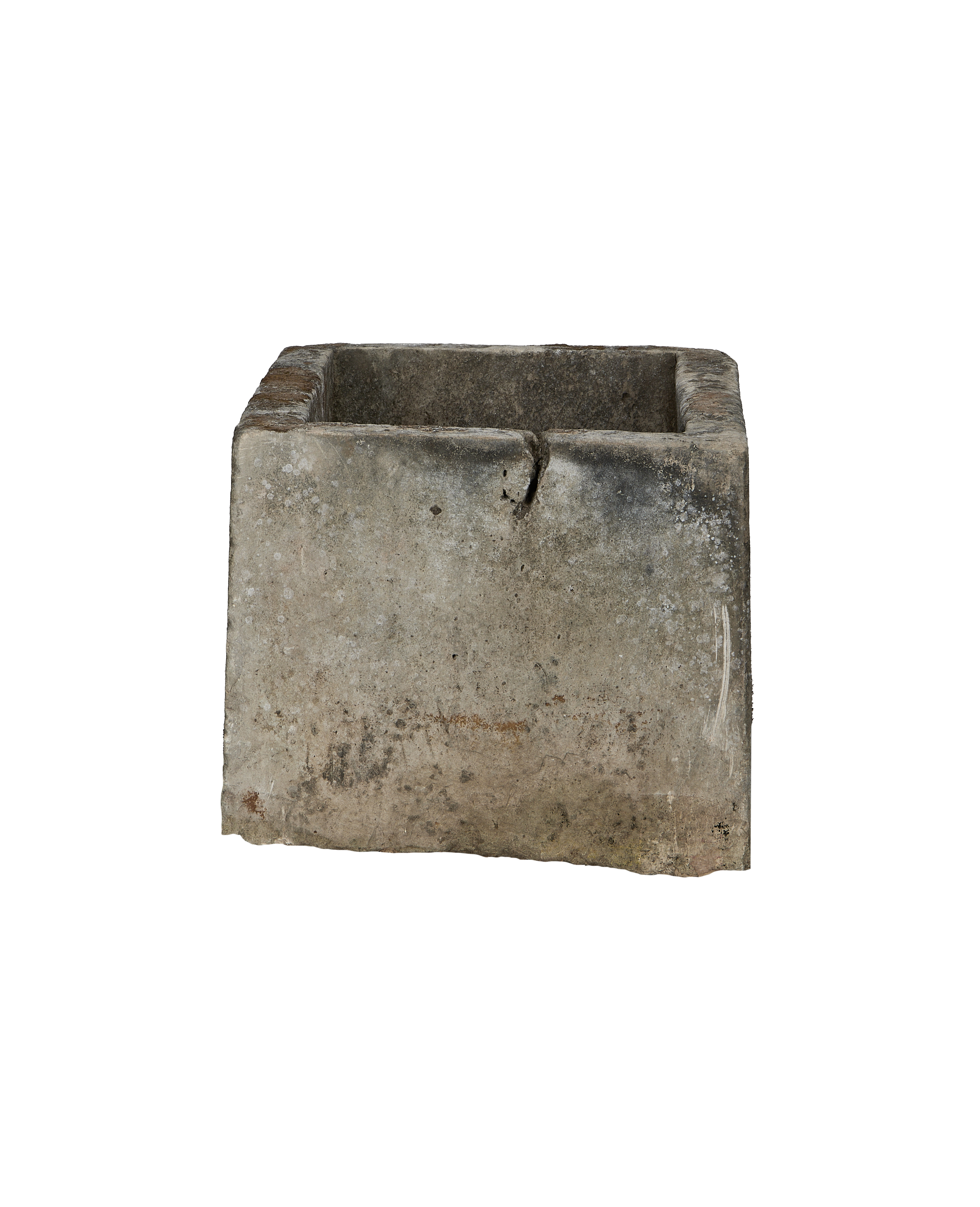 Vintage rectangular limestone trough, detail of aged concrete texture and drain hole.