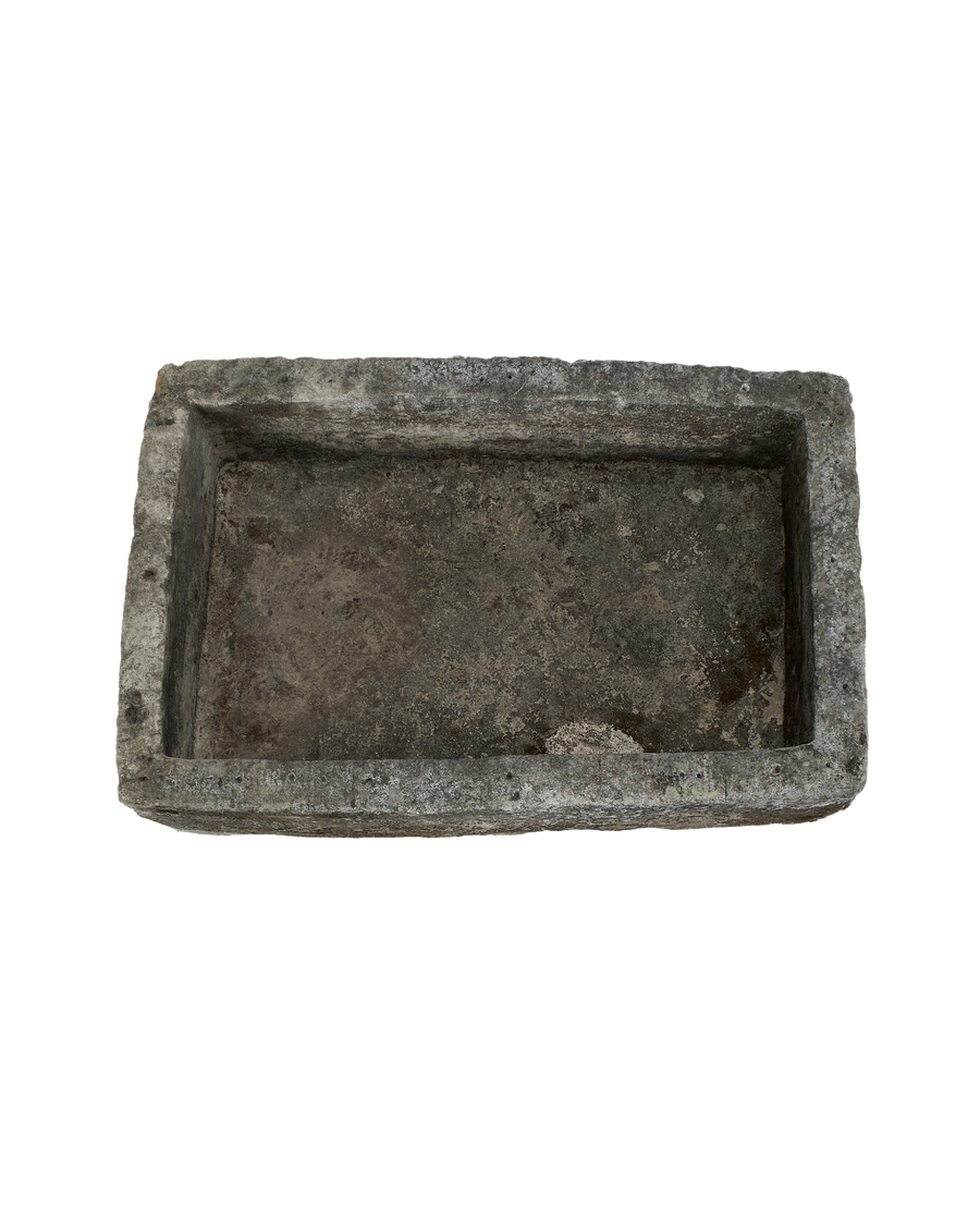 Vintage Indonesian rectangular limestone trough, top-down view showing interior and rough texture.