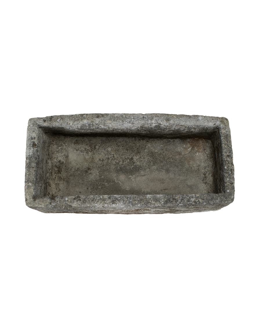 Vintage Indonesian limestone trough, top view, showing weathered, textured interior.
