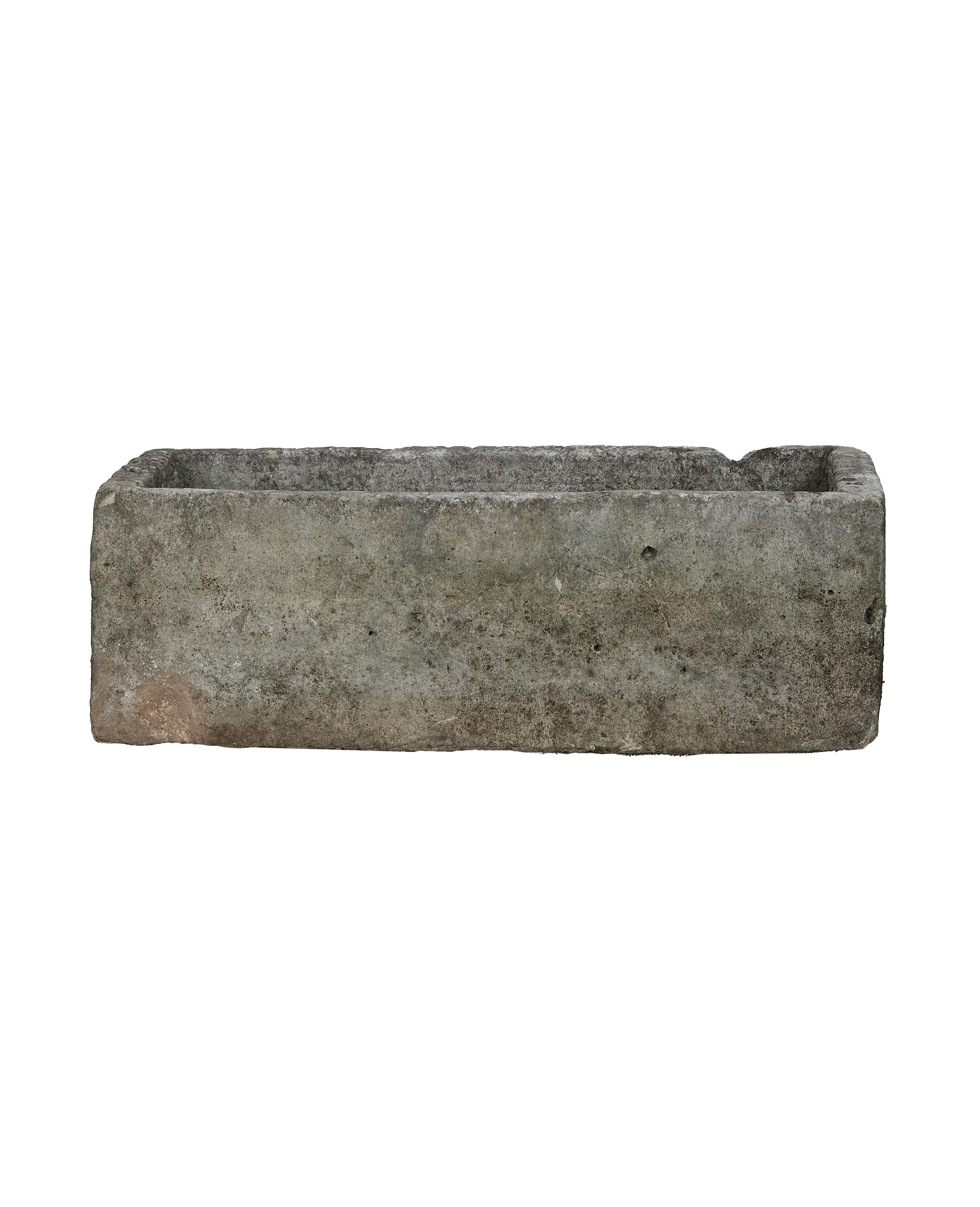 Vintage Indonesian rectangular limestone trough, detailed texture of the weathered gray, rough surface.