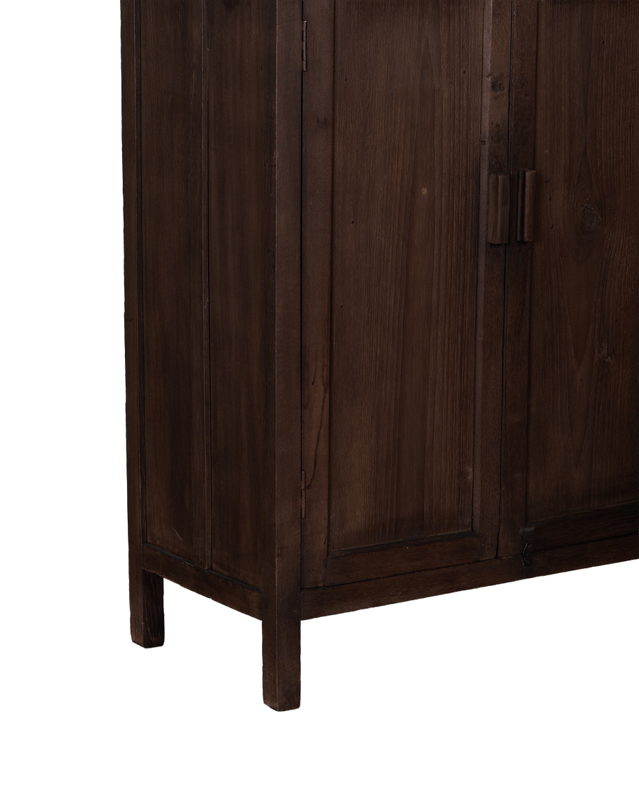 Vintage Indian oak cabinet featuring dark-stained wood details and paneling.