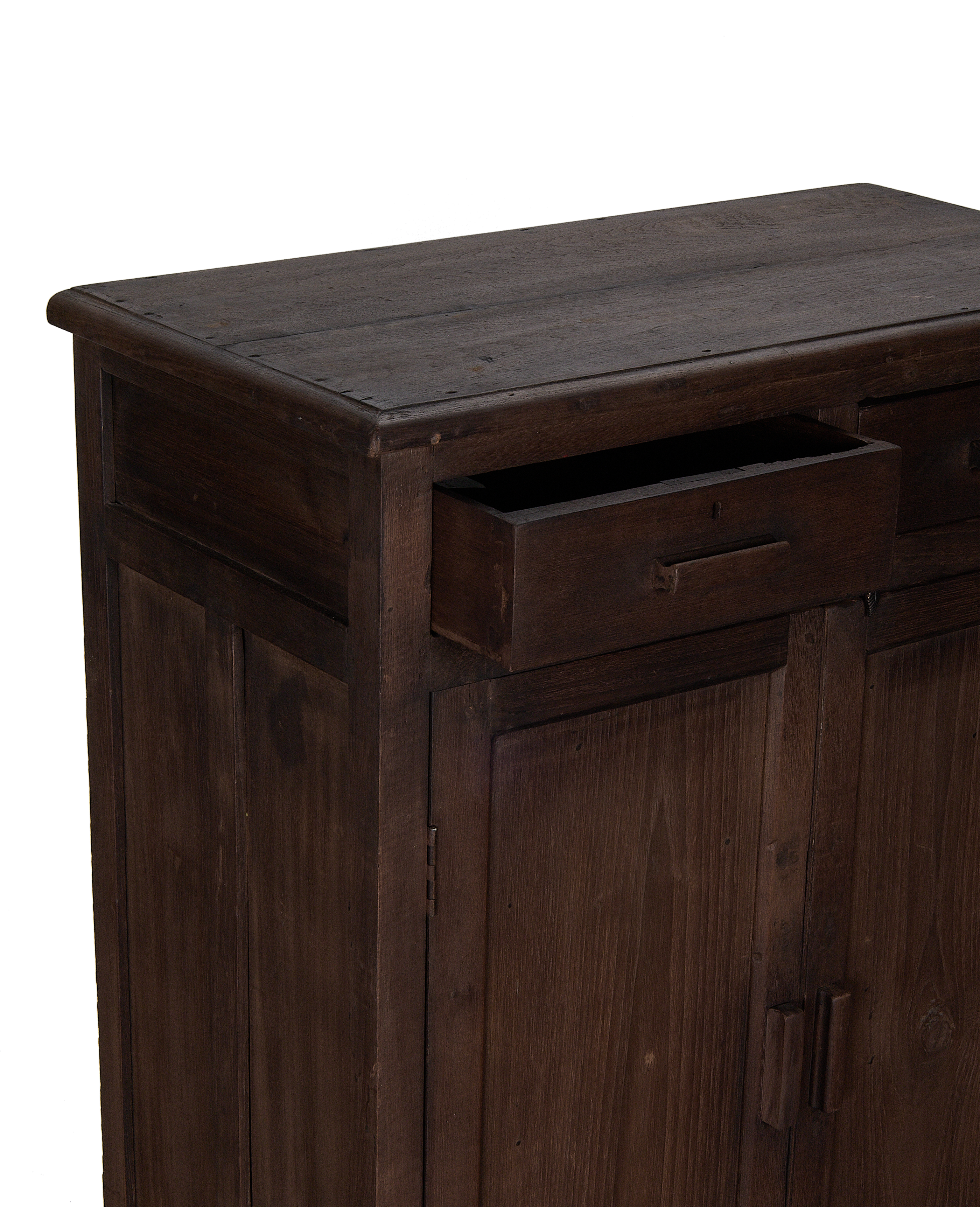 Vintage oak cabinet, India, partially open drawer revealing interior storage, dark-stained finish.