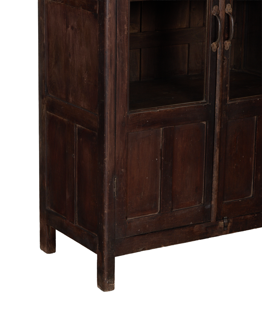 Vintage Indian oak cabinet bottom section, showing distressed wood, feet, and glass doors.