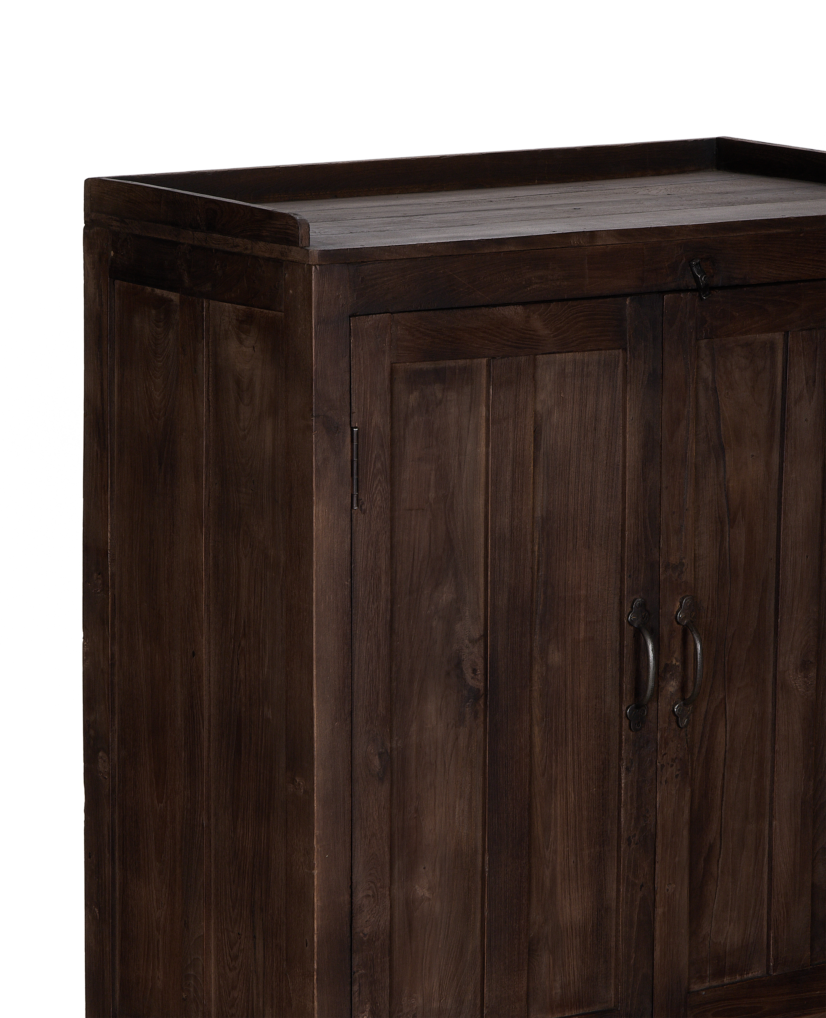Vintage dark oak cabinet from India, showing rustic detailed top and cabinet doors.