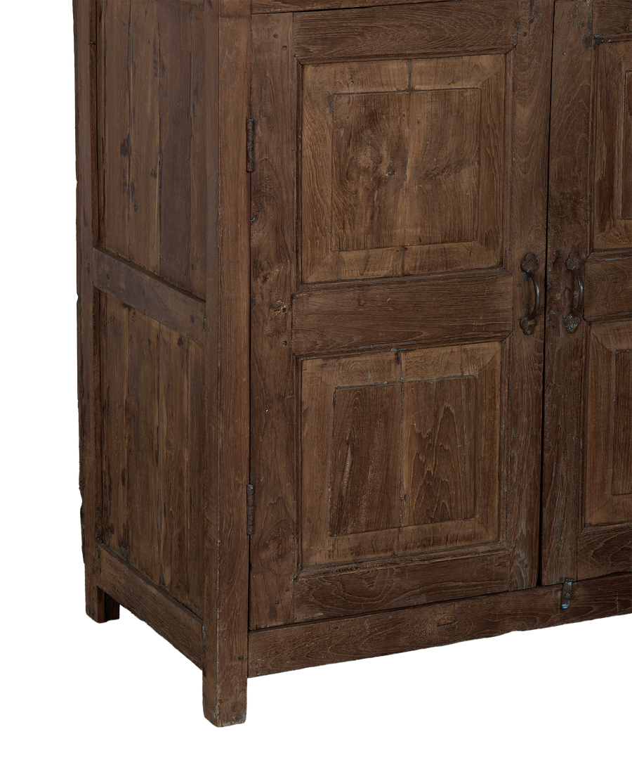 Vintage Indian oak wood cabinet, showing side panel, foot, and distressed wood grain.