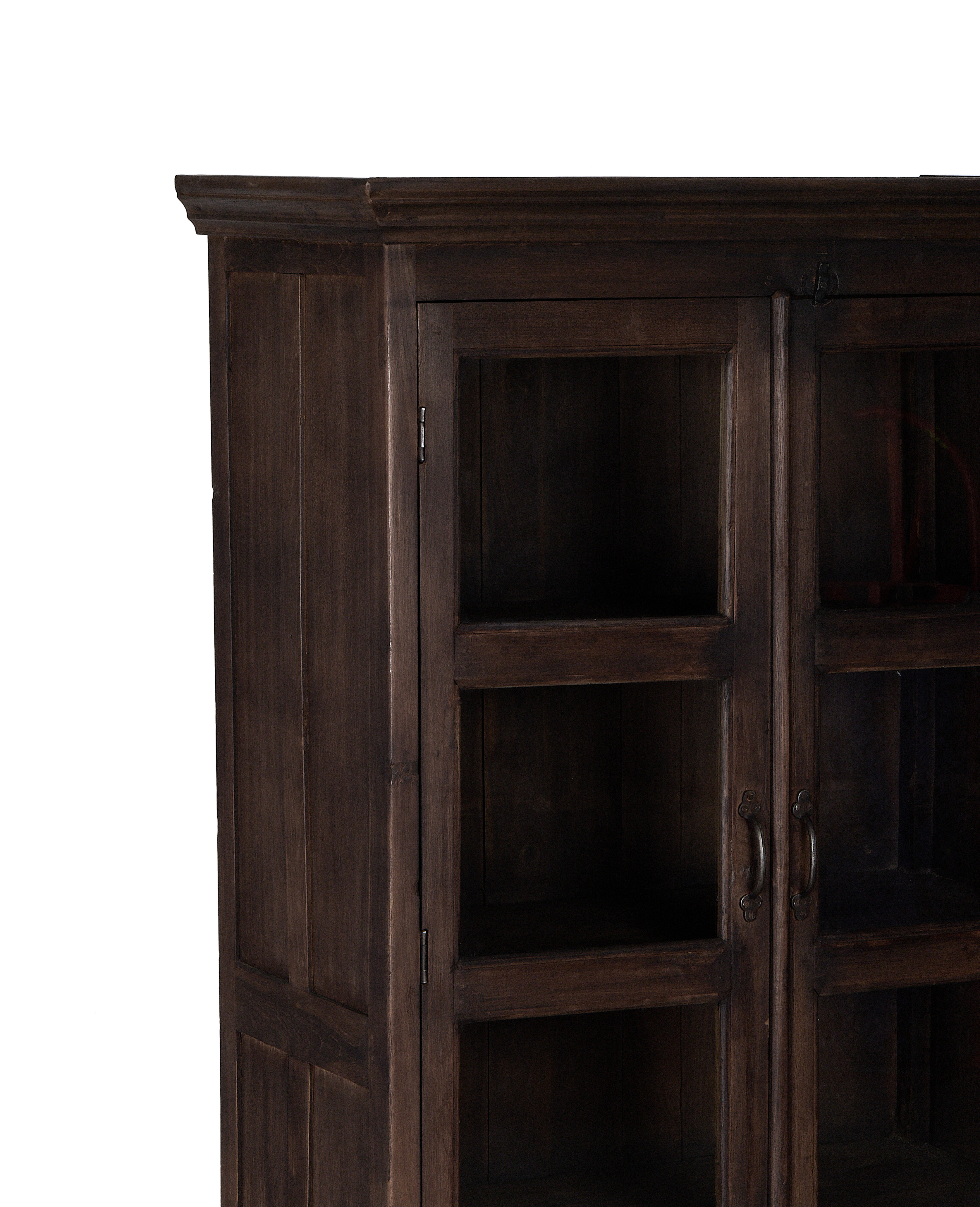 Upper left detail of vintage stained oak wood cabinet with glass doors.