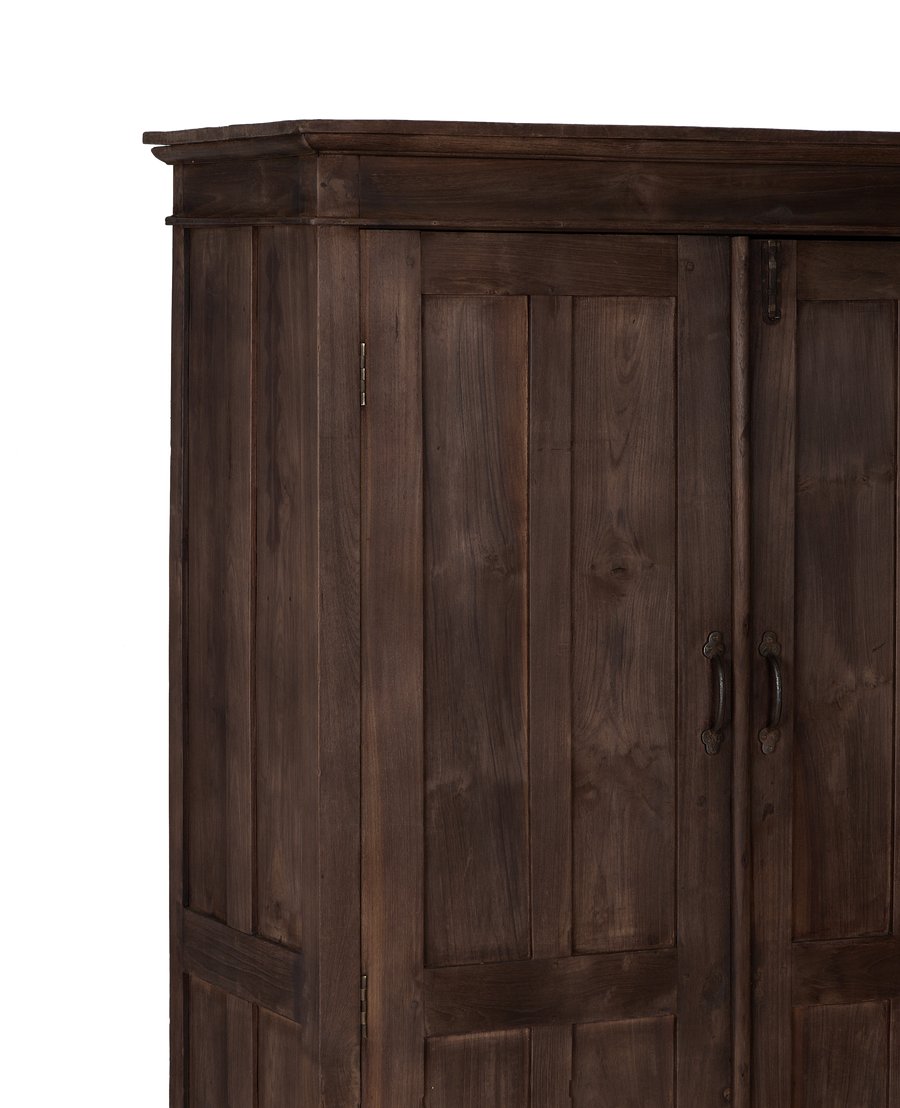 Vintage Indian oak wood cabinet, showing decorative top trim and right door handles.