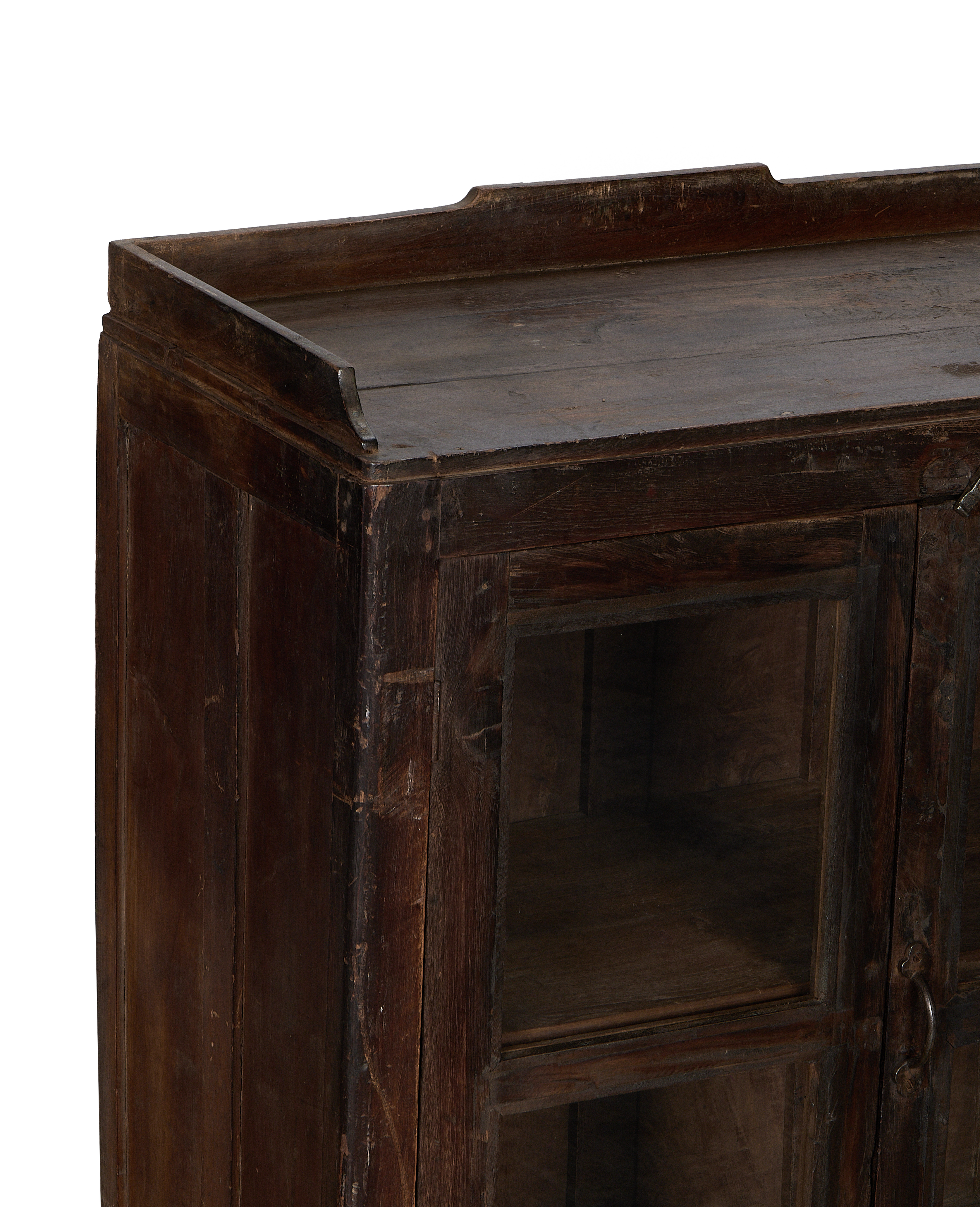 Vintage Indian oak cabinet: detailed close-up of aged wood grain and glass panels.