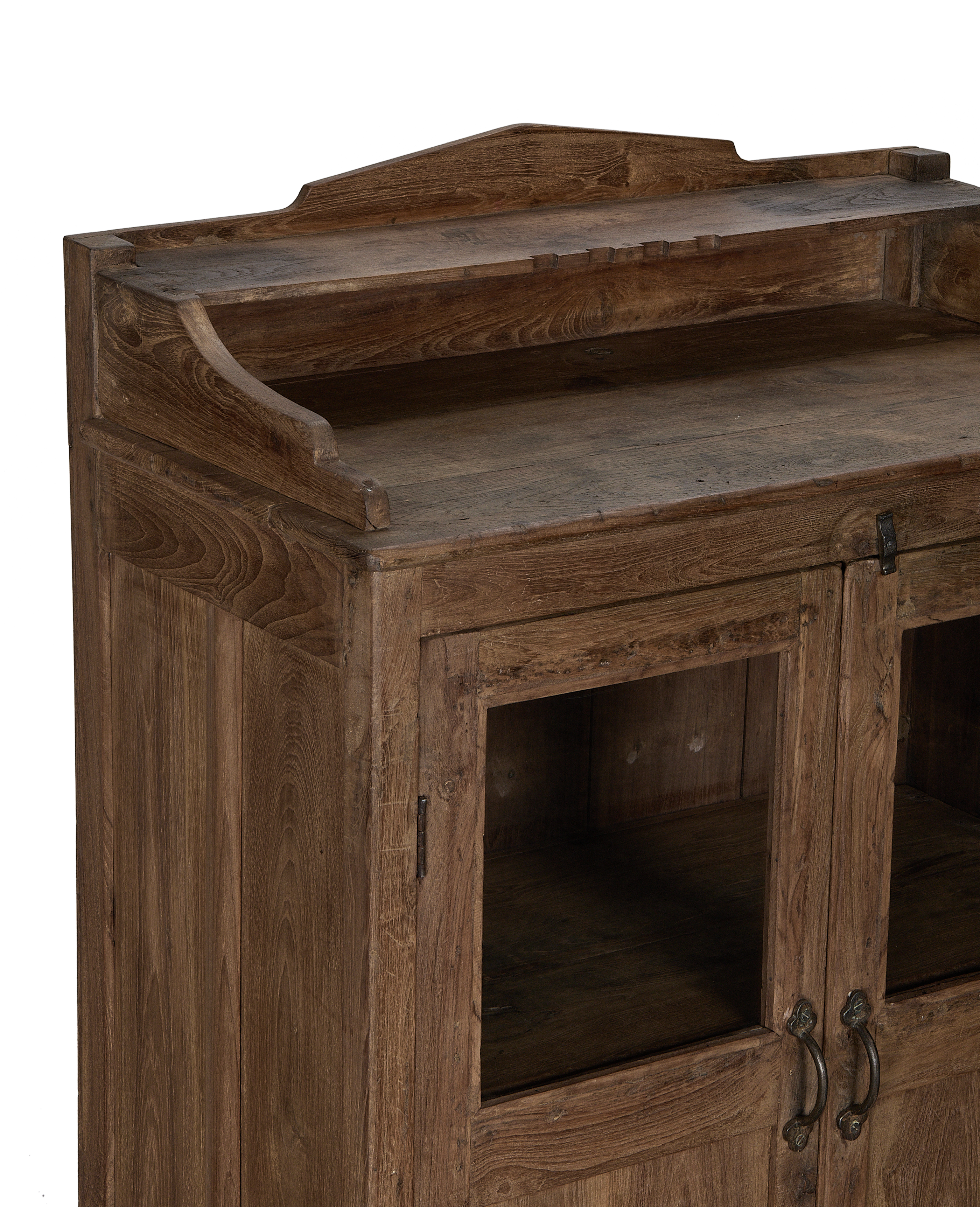 Vintage oak cabinet from India, displaying rustic details of the top and doors.