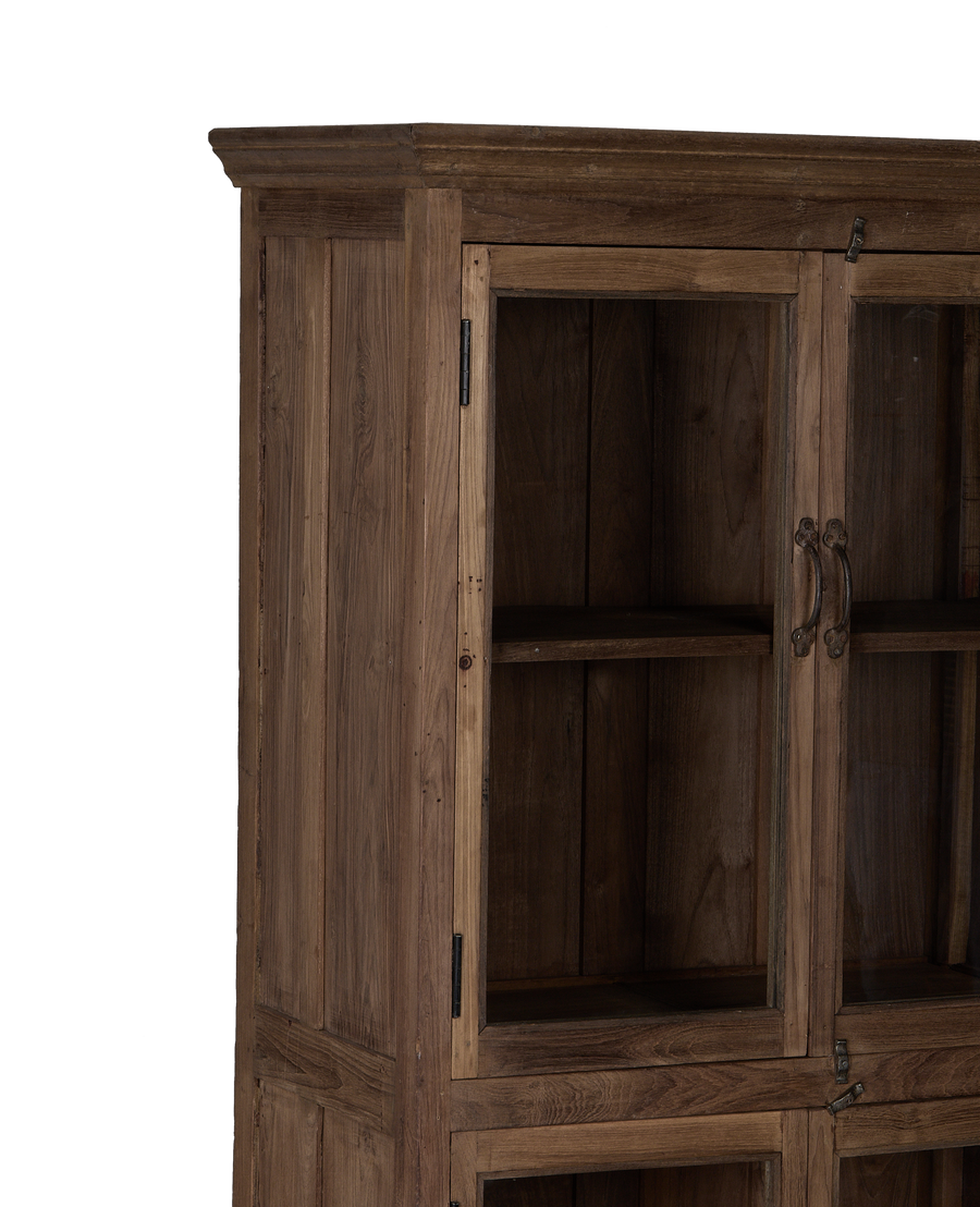 Vintage Indian oak wood cabinet, close-up of natural grain, glass doors, and aged hardware.
