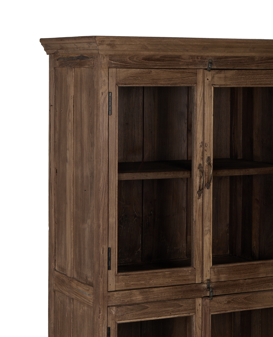 Vintage Indian oak wood cabinet, close-up of glass doors, antique brass hardware.