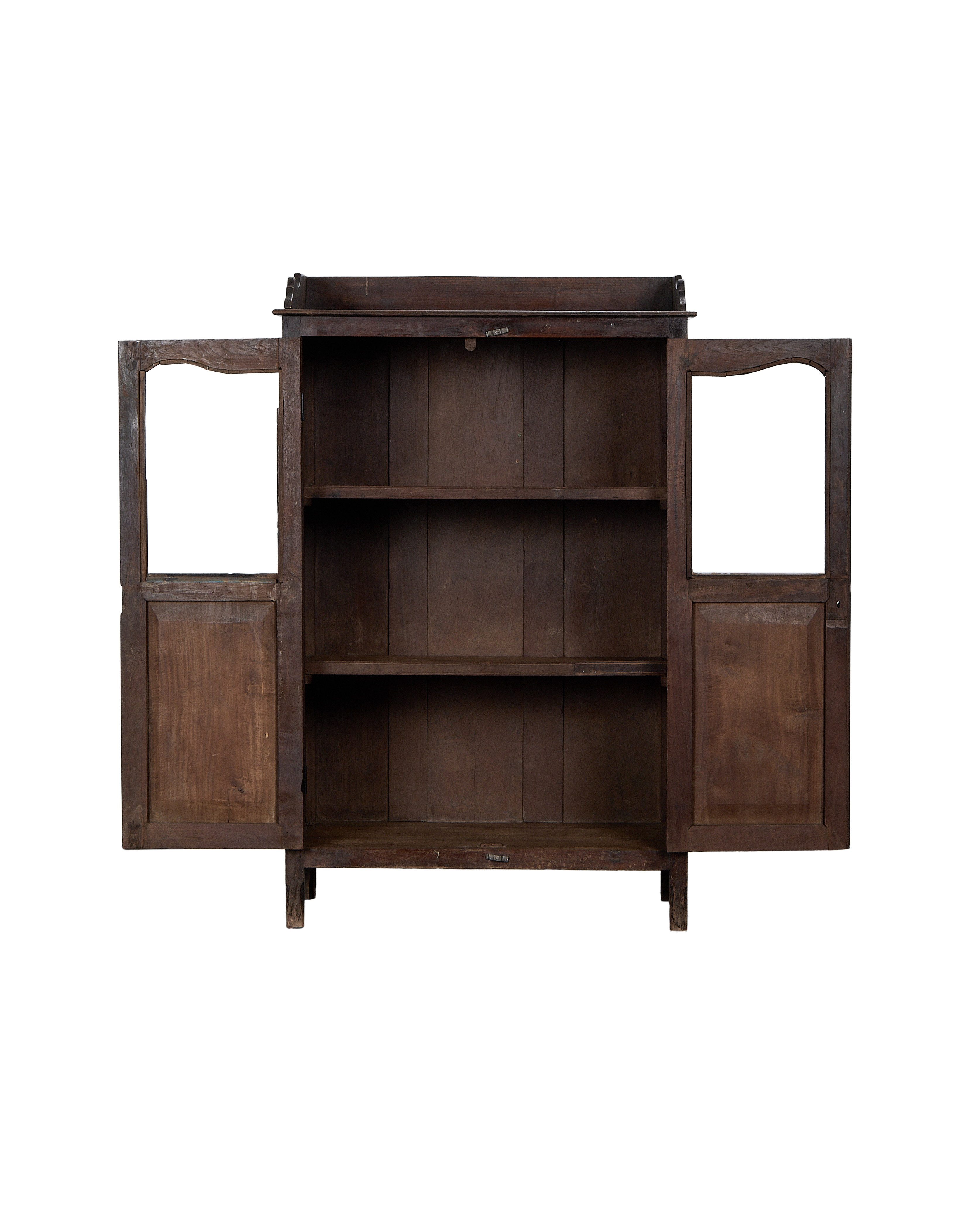Open vintage Indian oak cabinet showing empty interior shelves and natural wood grain.