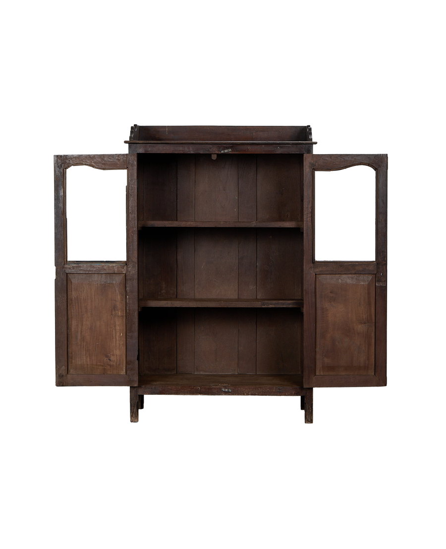 Open vintage Indian oak cabinet showing empty interior shelves and natural wood grain.