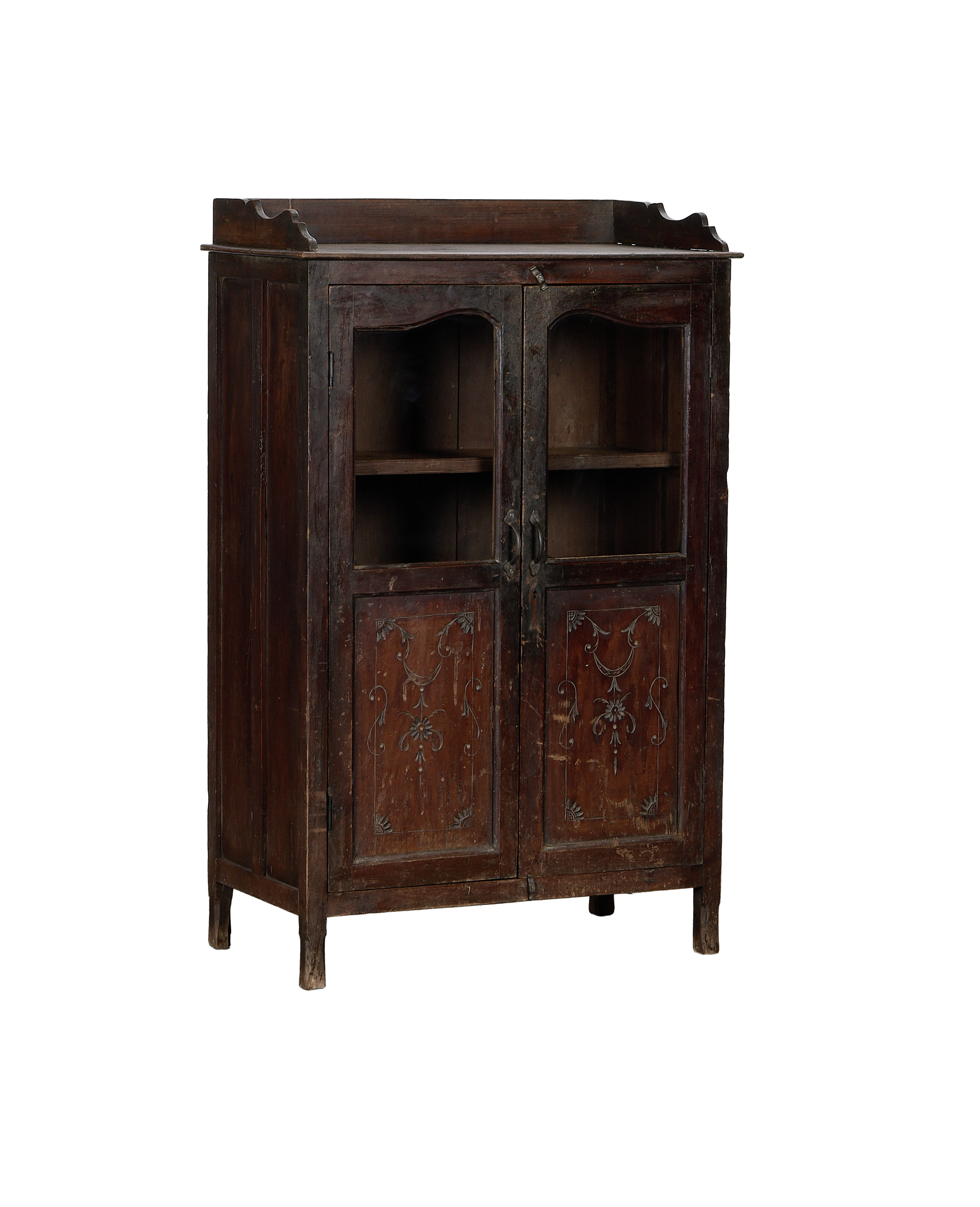 Vintage Indian oak cabinet, full frontal view, showing glass doors, brass hardware, and detailed lower carvings.