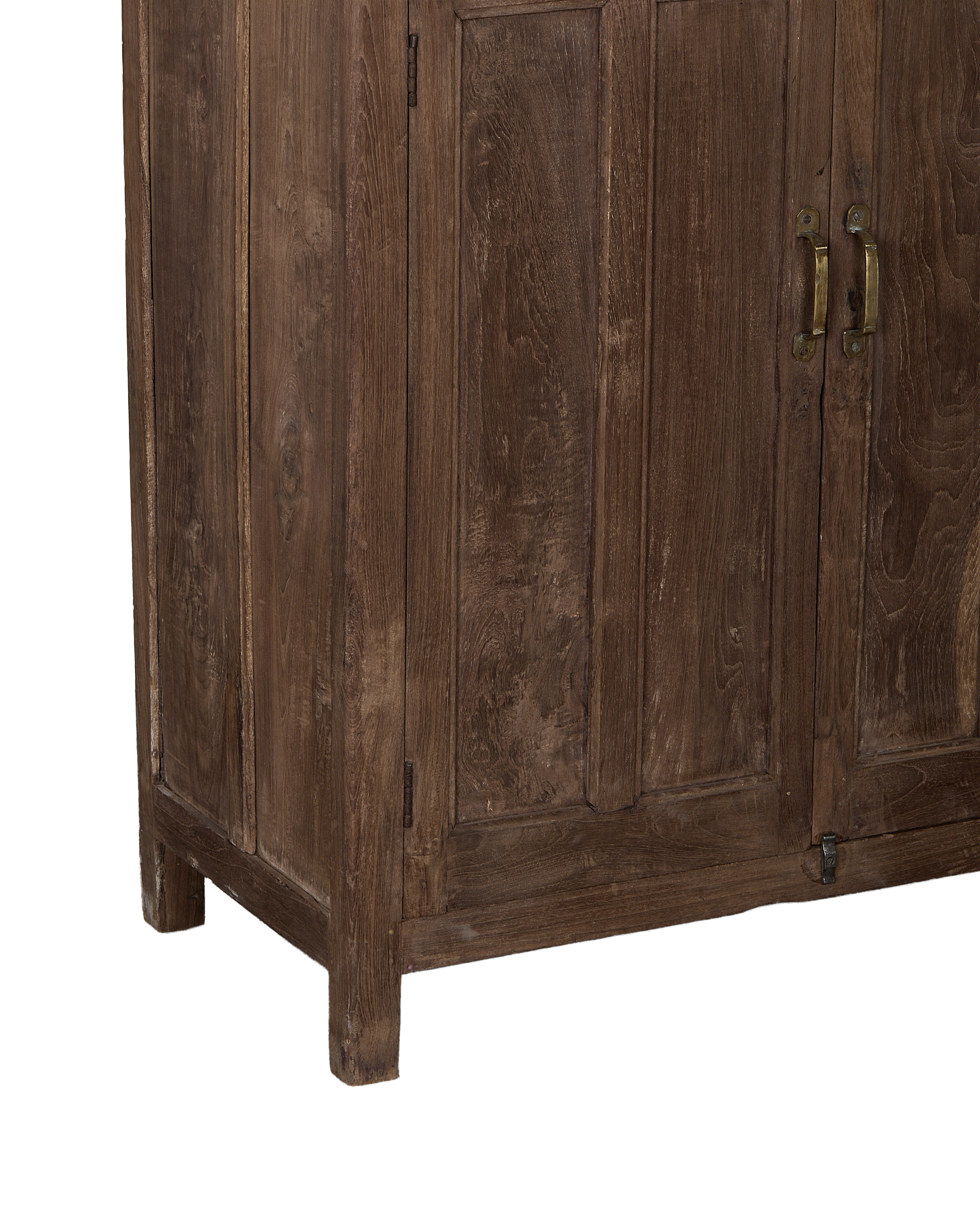 Vintage Indian oak cabinet showing distressed natural wood grain, brass handles, and sturdy base.