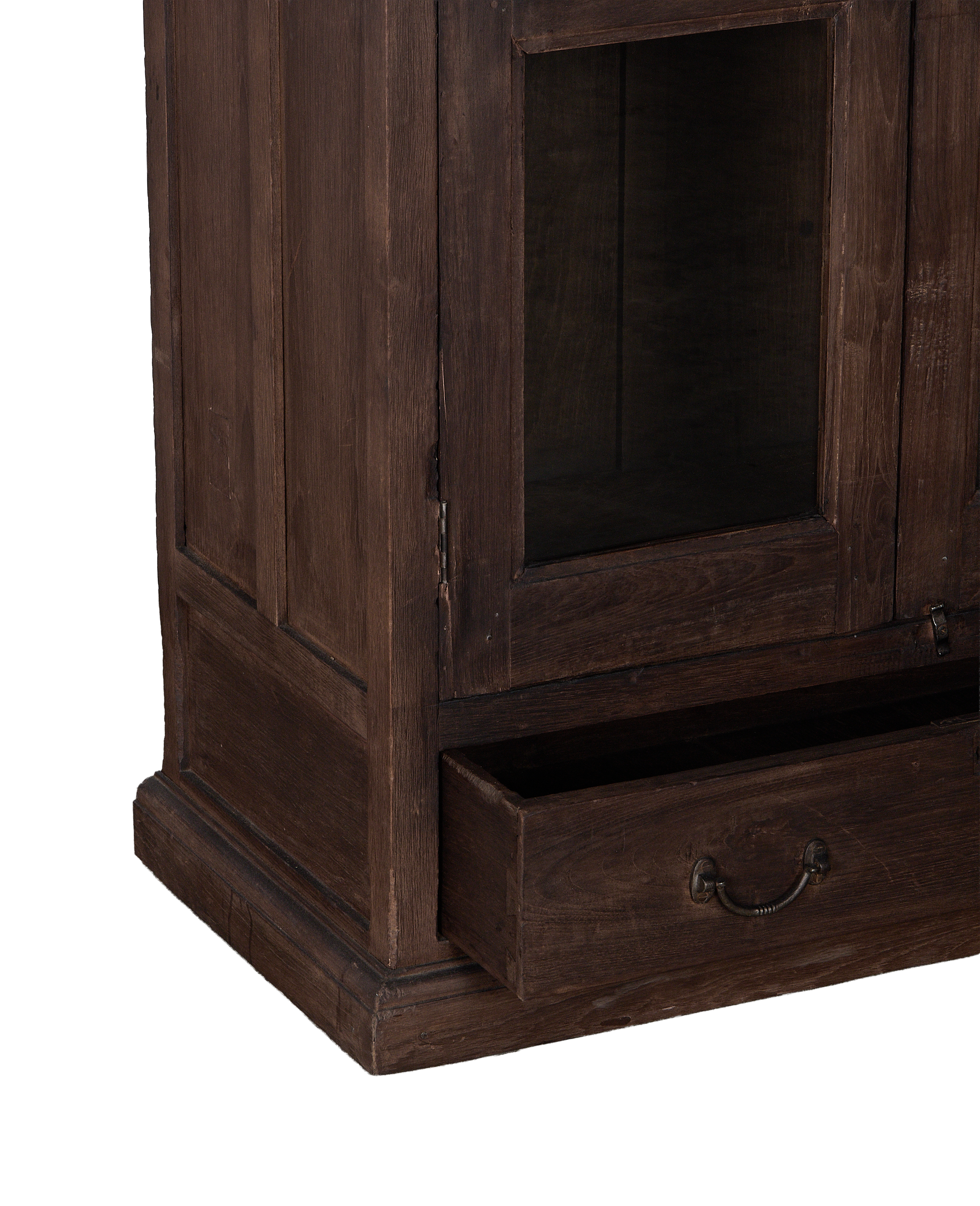 Vintage Indian oak cabinet bottom showing open drawer with antique brass pull.
