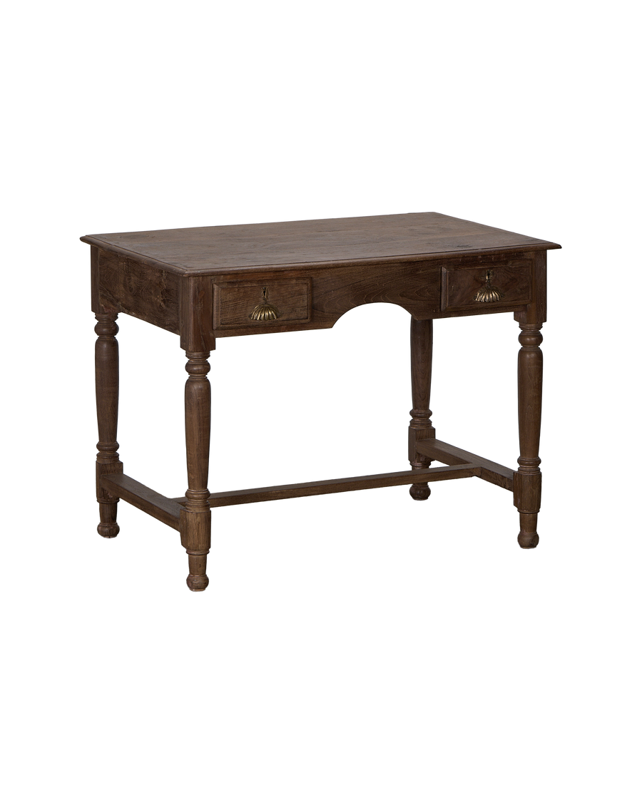 Vintage natural oak writing desk from India, showing ornate drawer pulls and turned legs.
