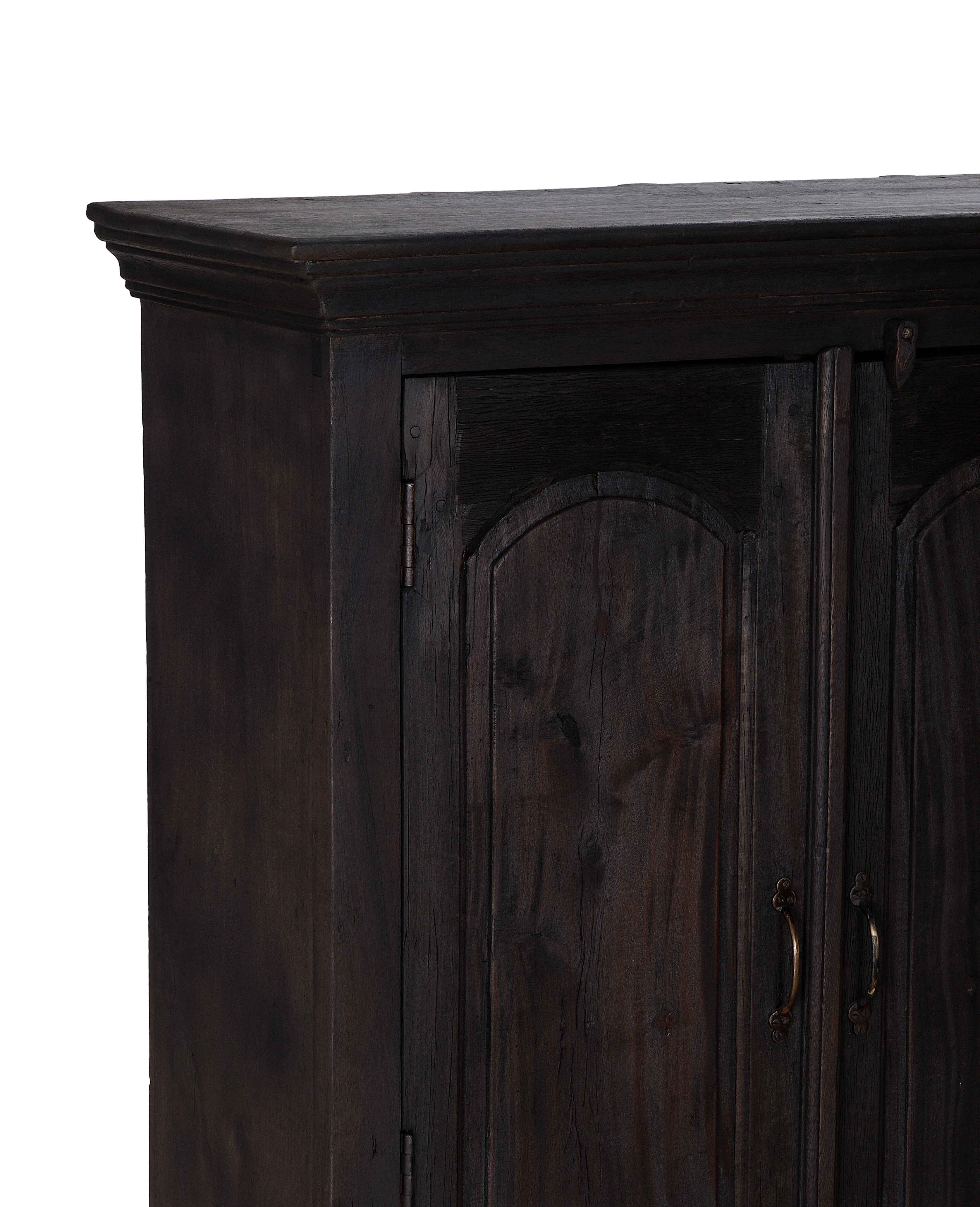 Detailed top right corner of vintage stained oak cabinet from India.