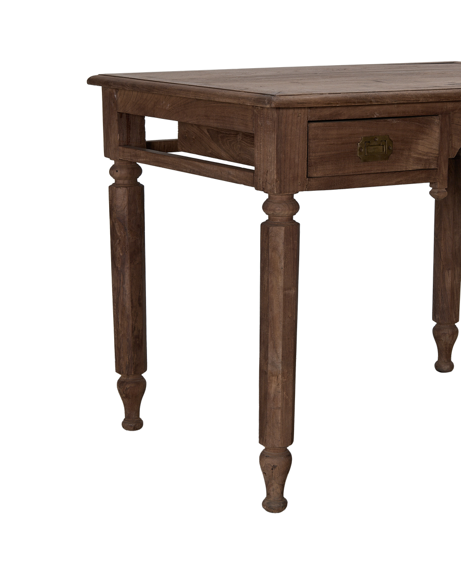 Vintage Indian oak desk, showing side drawer with brass pull and carved turned legs.