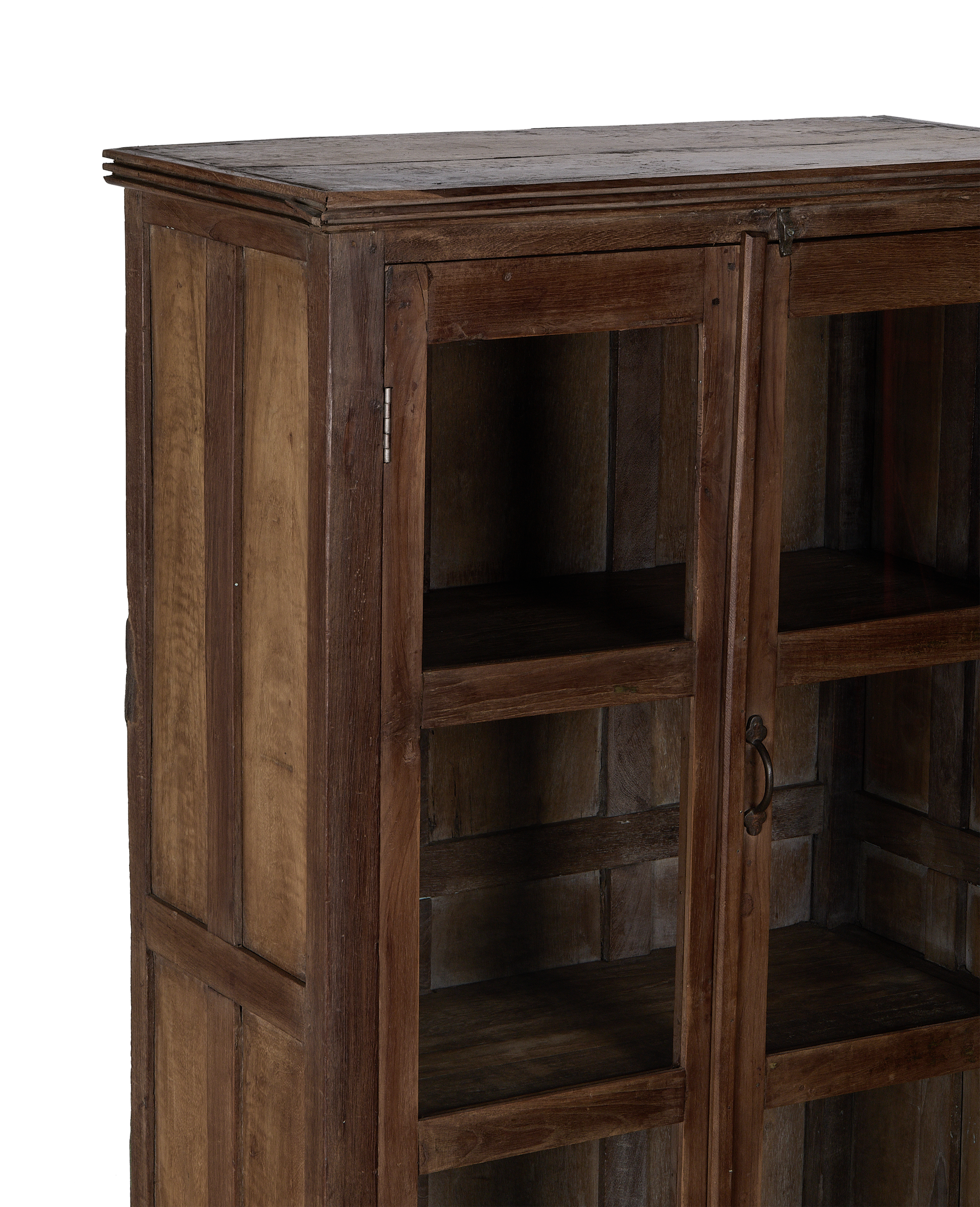 Vintage oak display cabinet from India, showing closed glass doors and interior shelves.