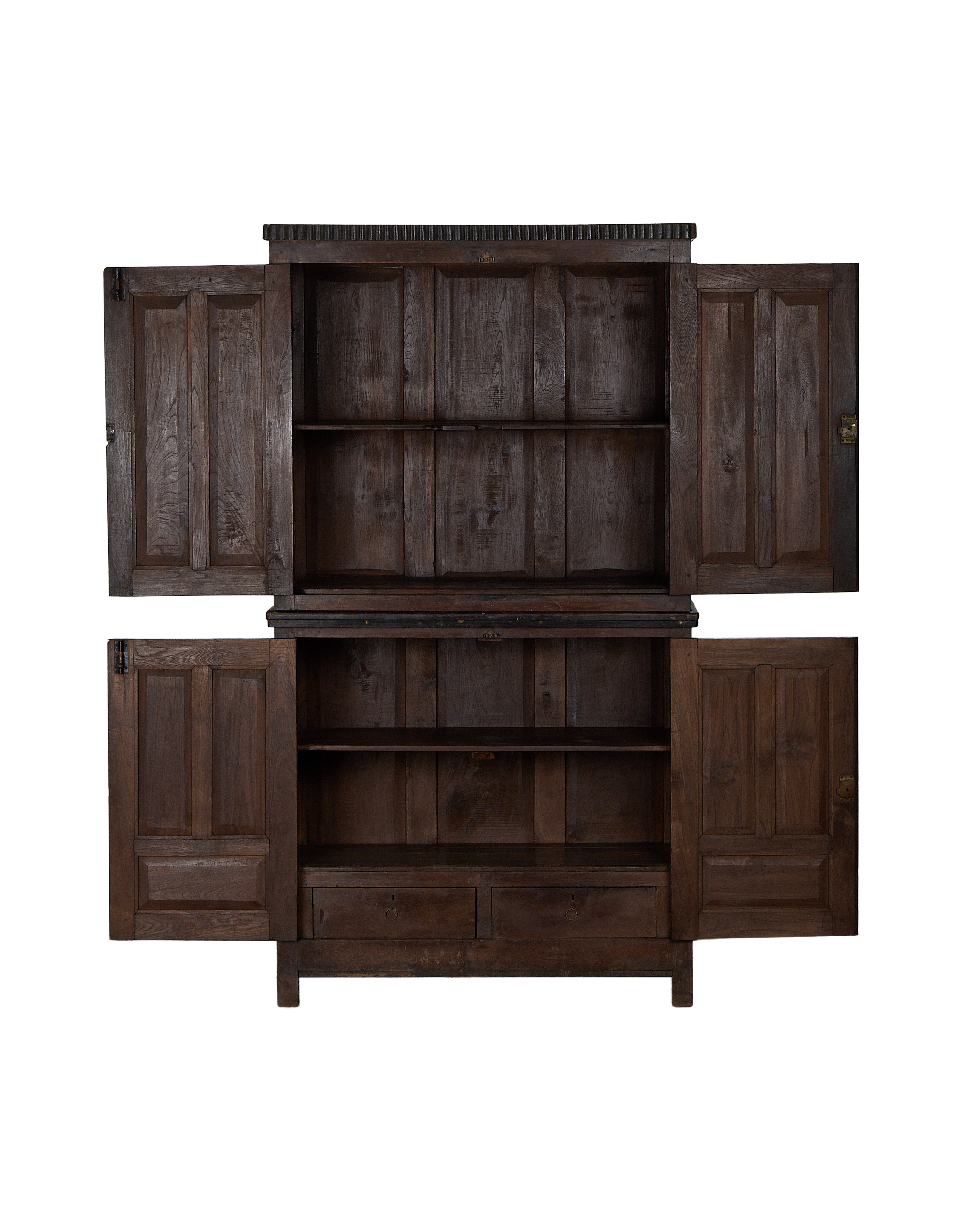 Vintage carved oak cabinet with all four doors open, revealing shelves and drawers inside.