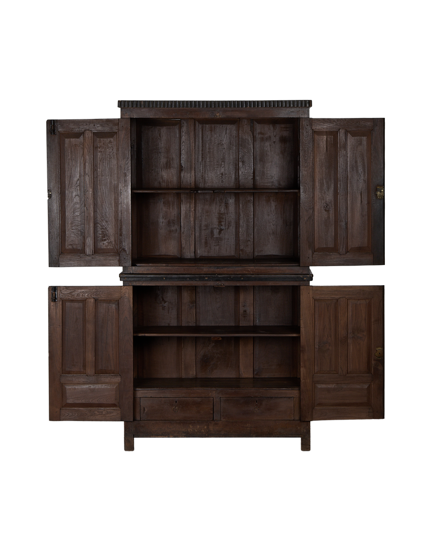 Vintage carved oak cabinet with all four doors open, revealing shelves and drawers inside.