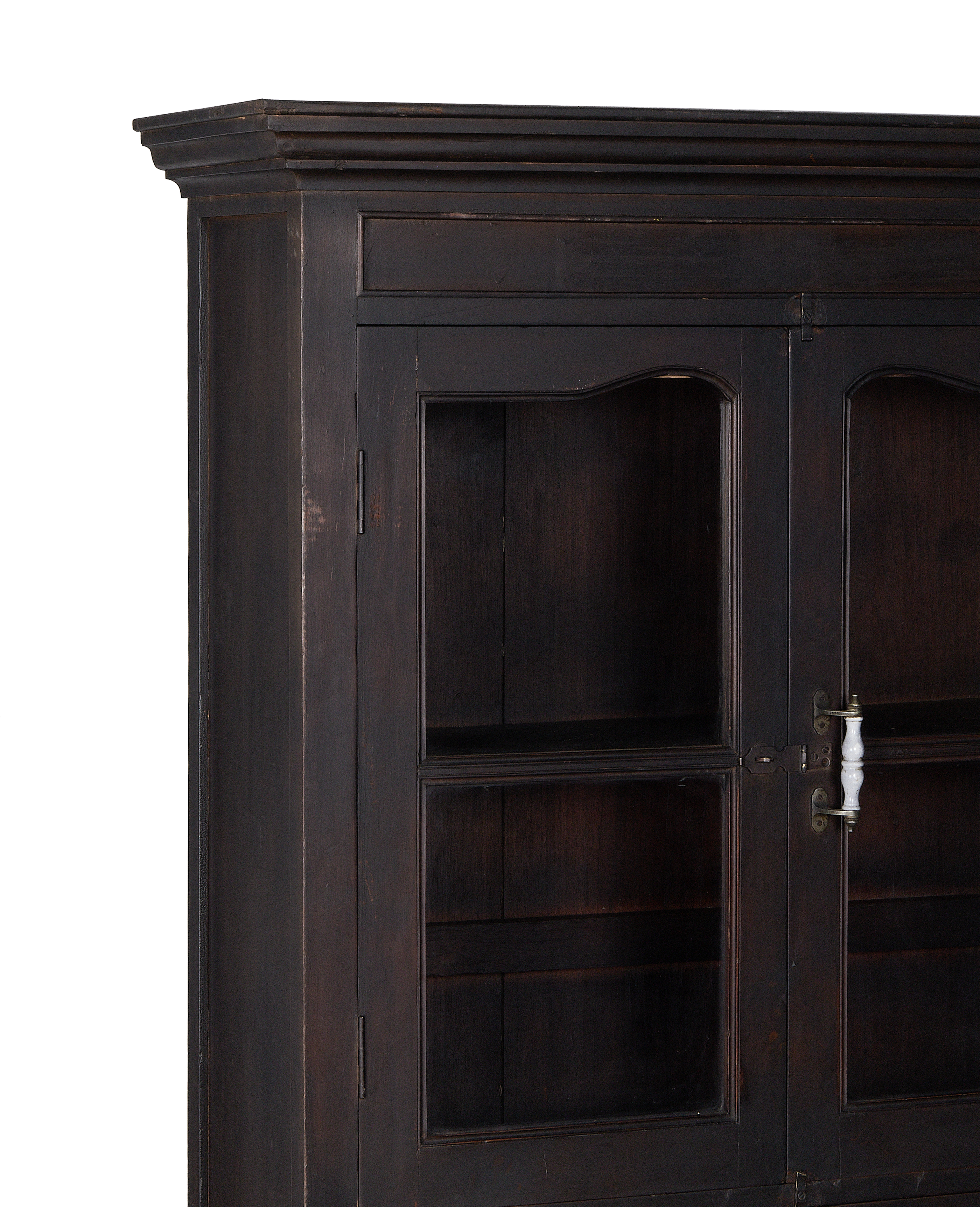 Vintage dark stained Indian oak cabinet, showing intricate molding and glass display shelves.