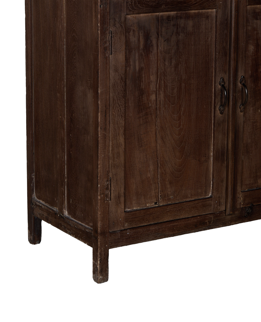 Vintage Indian oak cabinet bottom showing sturdy construction, dark wood grain, and aged patina.