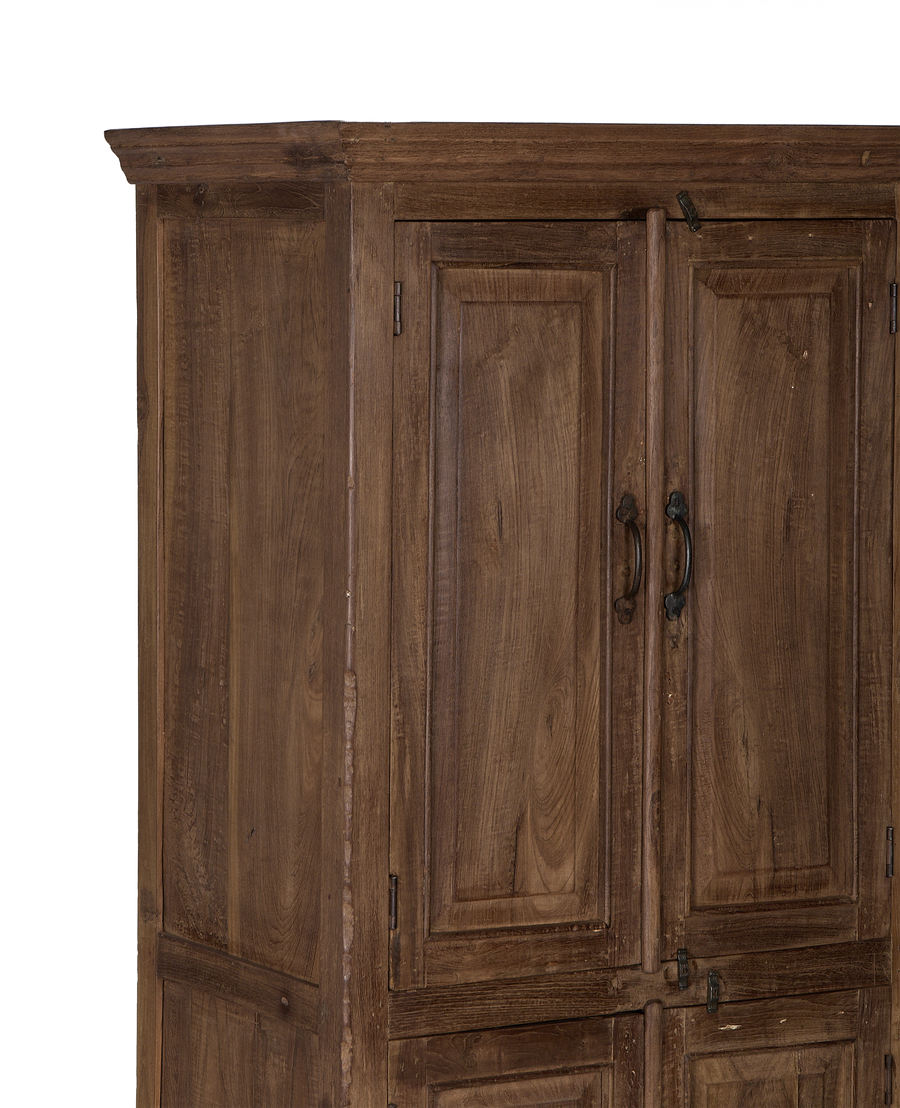 Vintage Indian oak cabinet details, showing natural wood grain, dark handles, and top cornice.