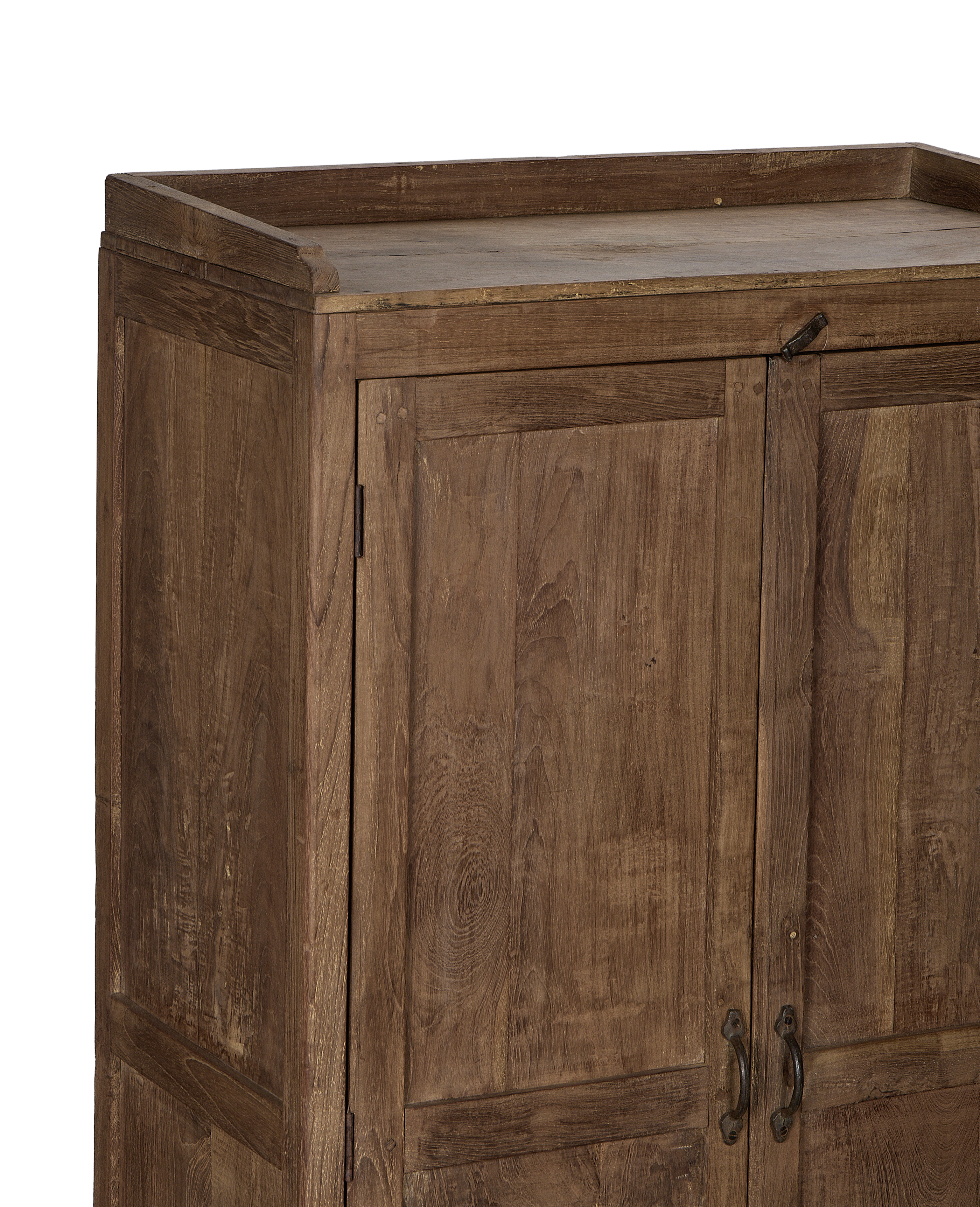 Close-up of vintage Indian oak wood cabinet with natural grain and rustic metal latch.